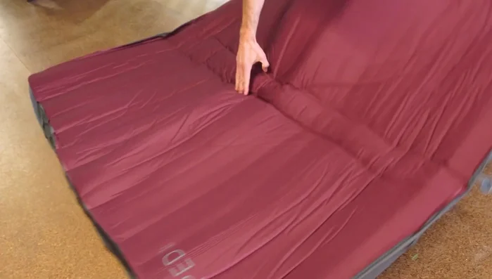 Unroll, then fold the mat in half again.