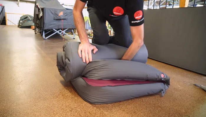 Place the rolled mat into its stuff sack.