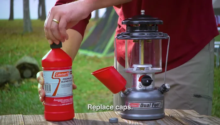 Replace and tighten the fuel caps on the lantern and fuel container. Wipe up any spilled fuel.