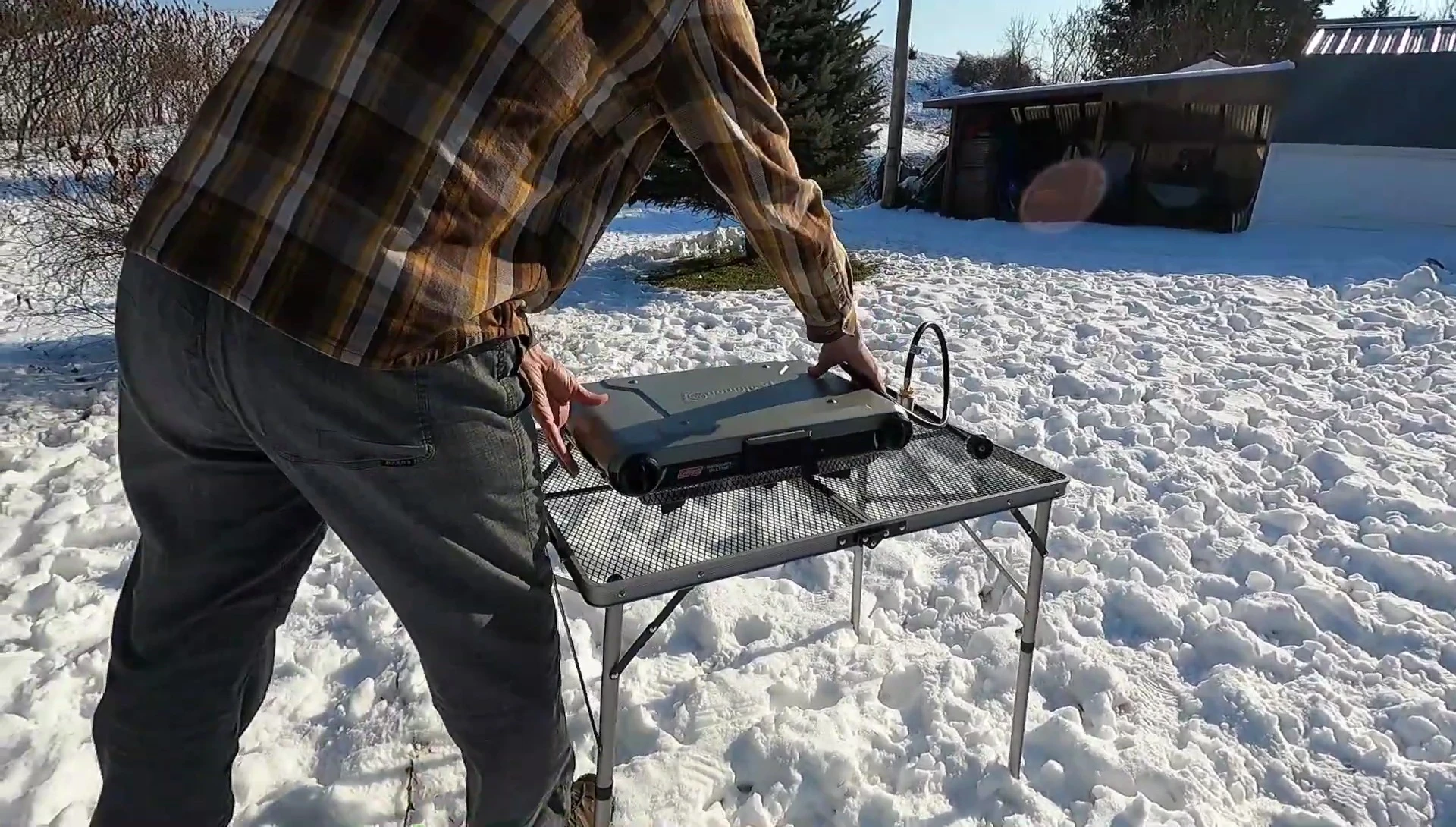 The table being used as a kitchen table during a camping trip.