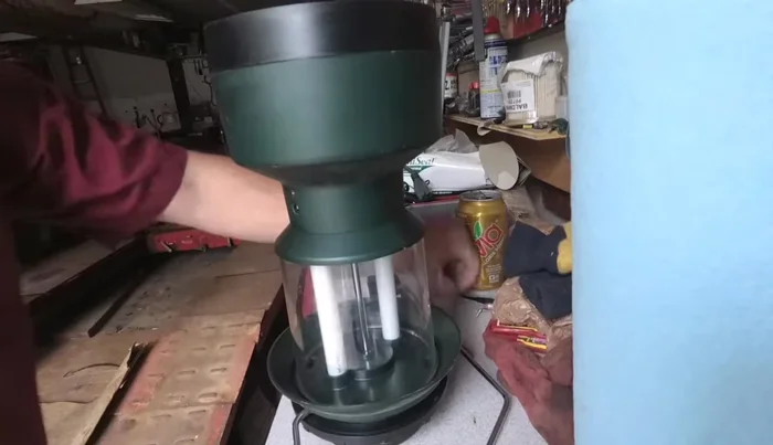 Gently remove the bottom base from the lantern body. Wiggle it until it comes loose.