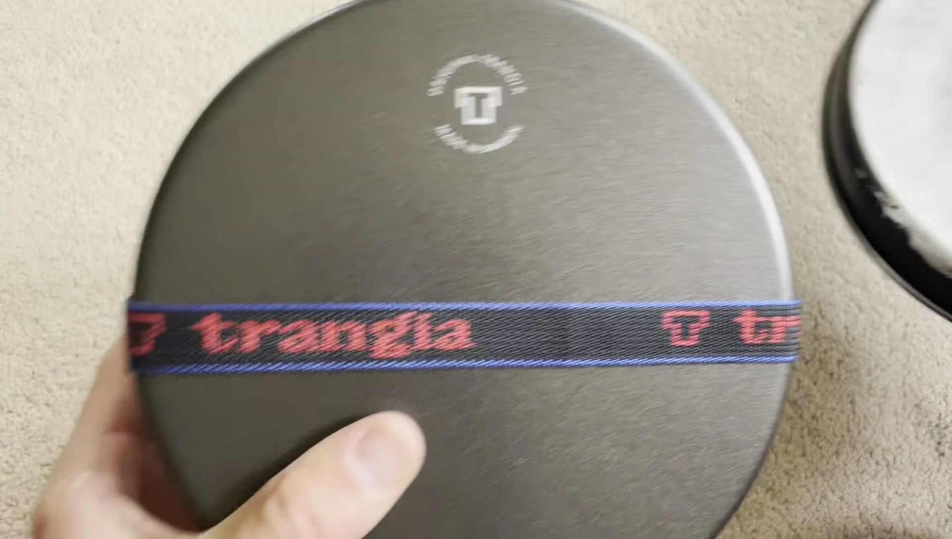 The worn-down non-stick surface of the pan.
