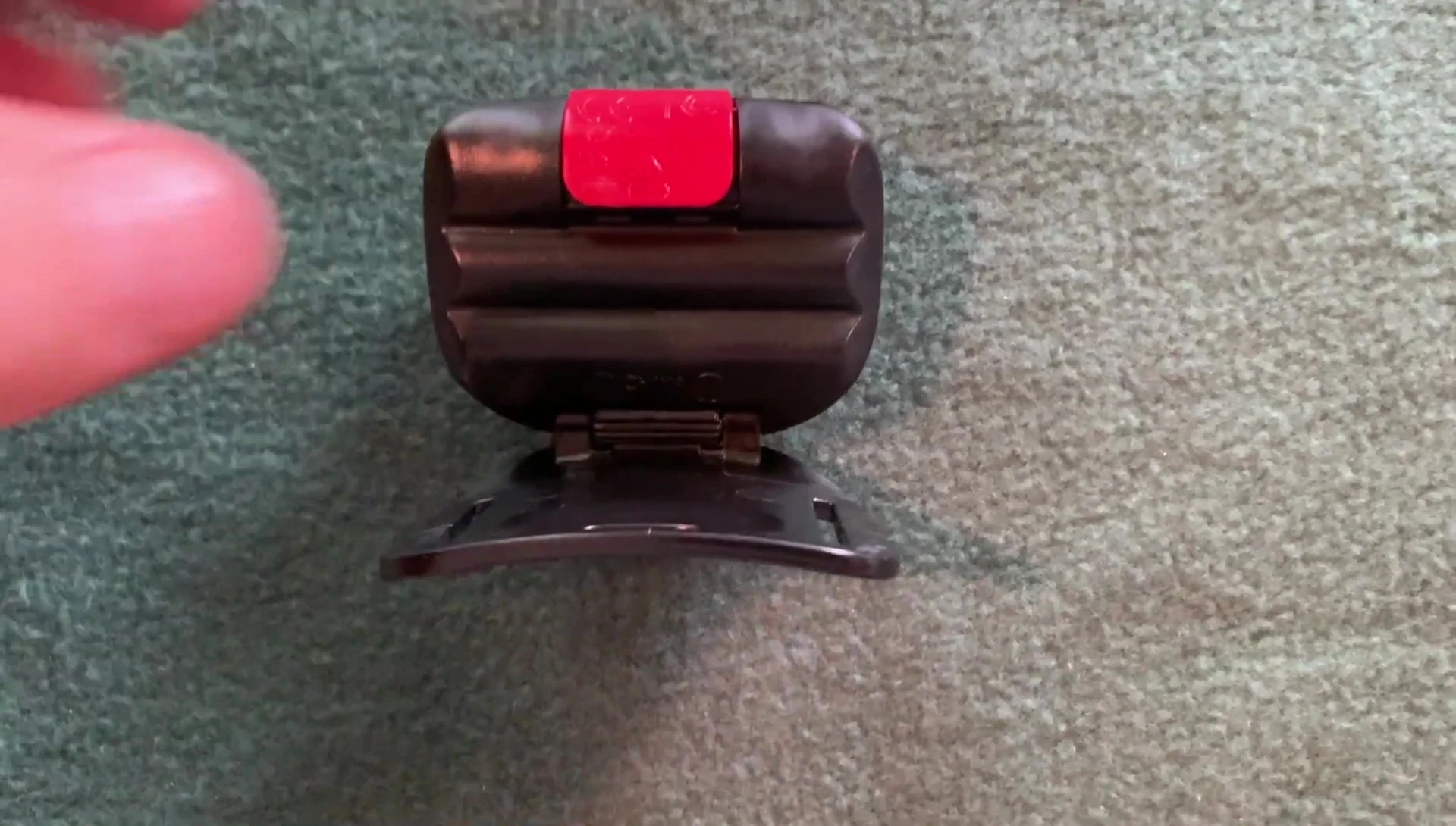 The easy-access battery compartment lever being demonstrated.