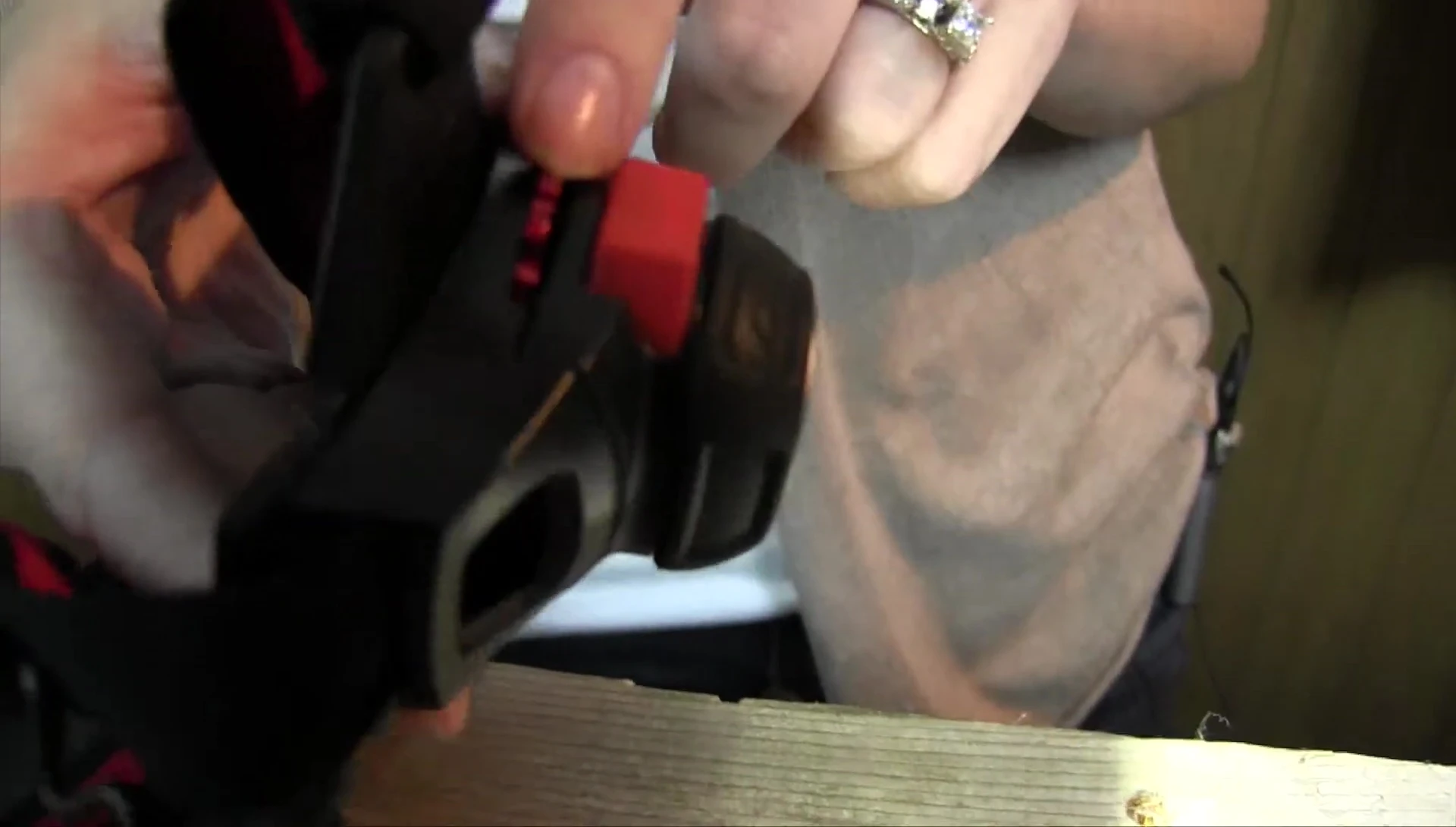 Hand demonstrating the use of the intensity dial.