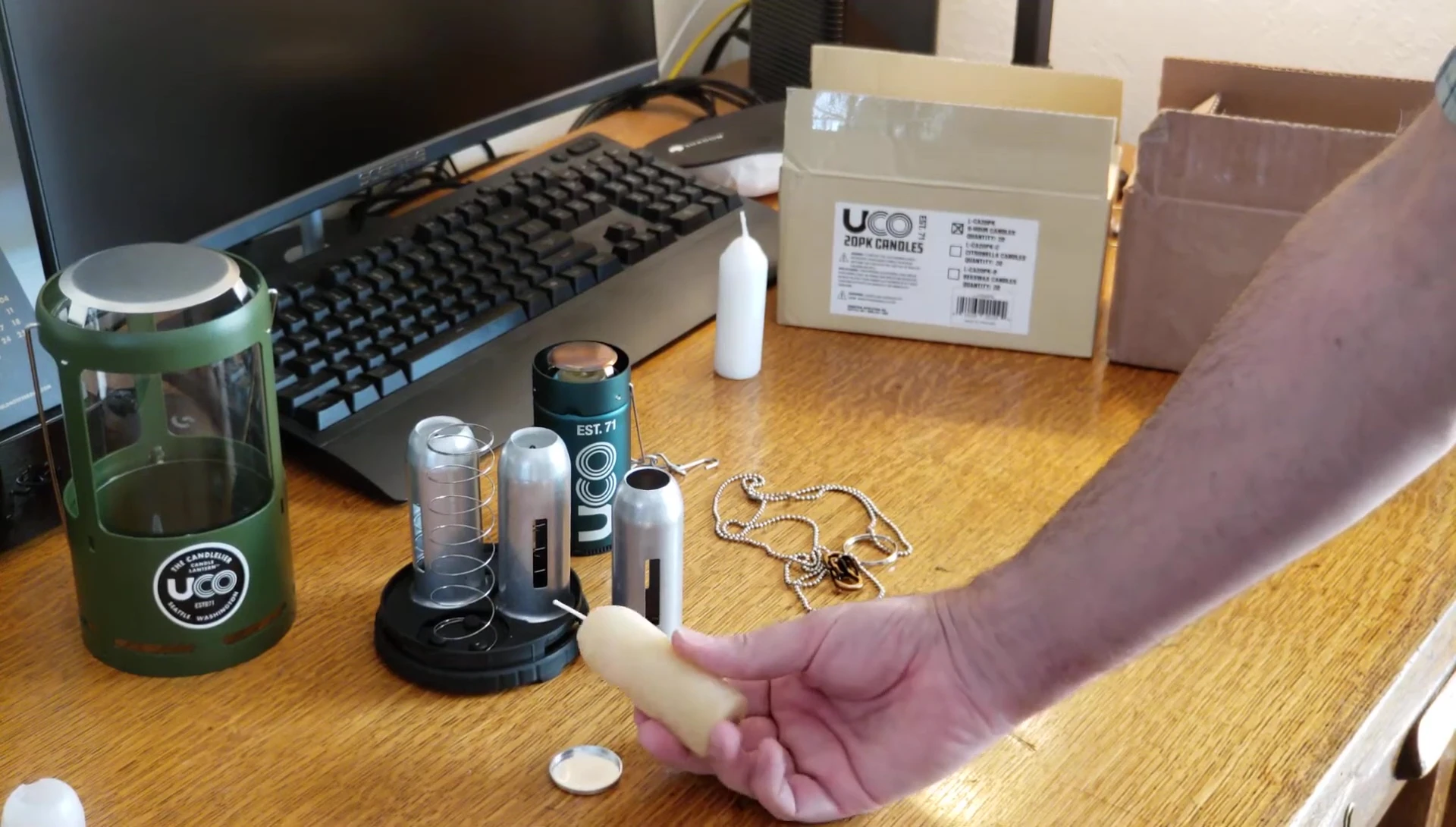 A view of the UCO beeswax candles packaging and a candle.