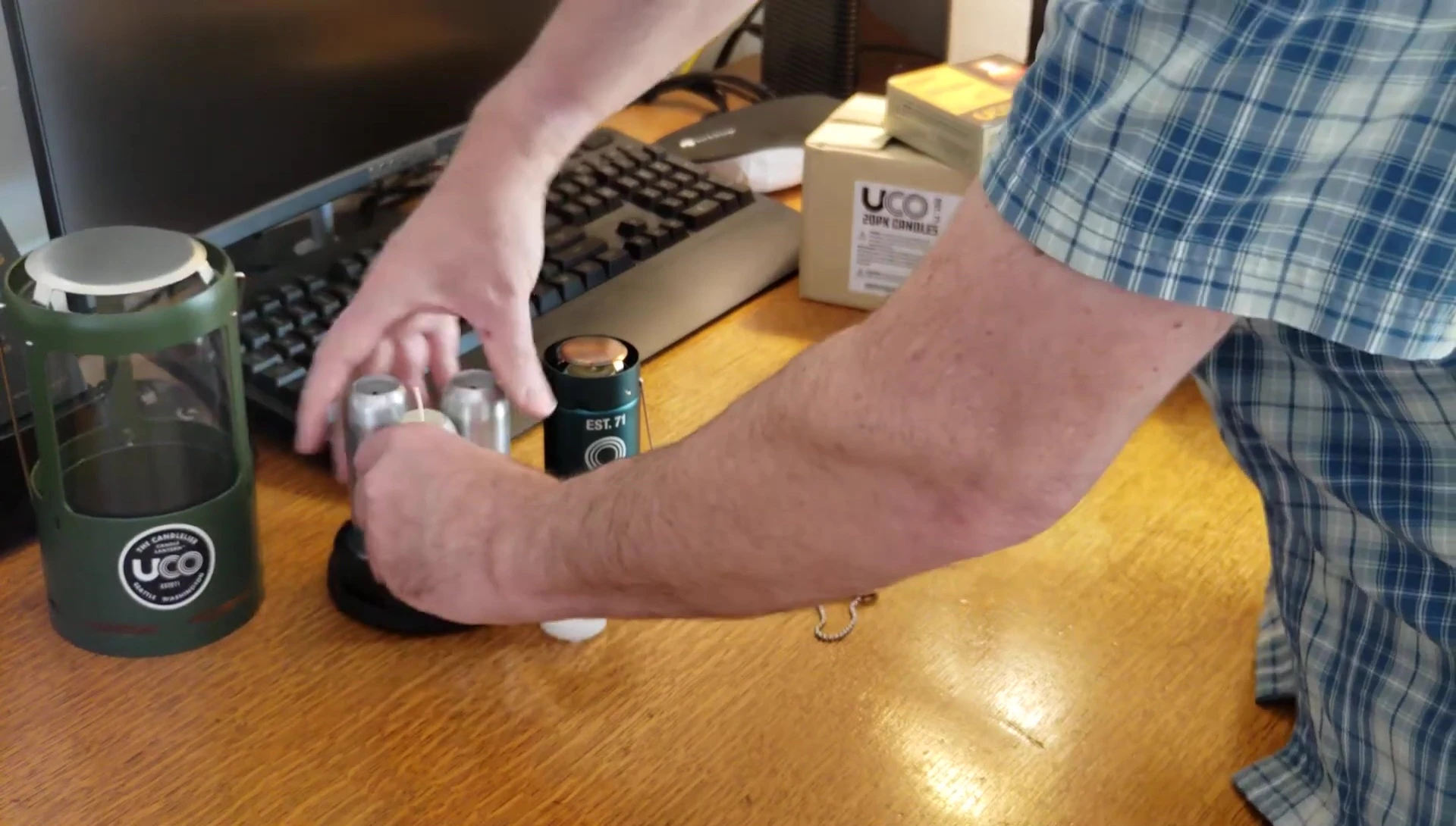 Detailed view of the spring-loaded candle holder mechanism.