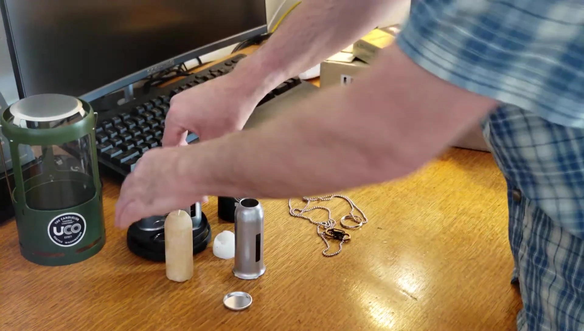 Demonstrating how the spring mechanism adapts to the melting candle.