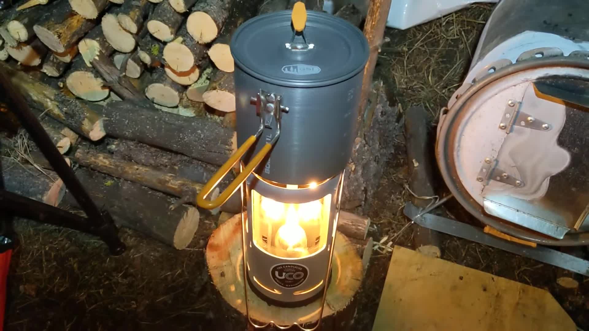 Close-up of the UCO Candle Lantern with three candles lit.
