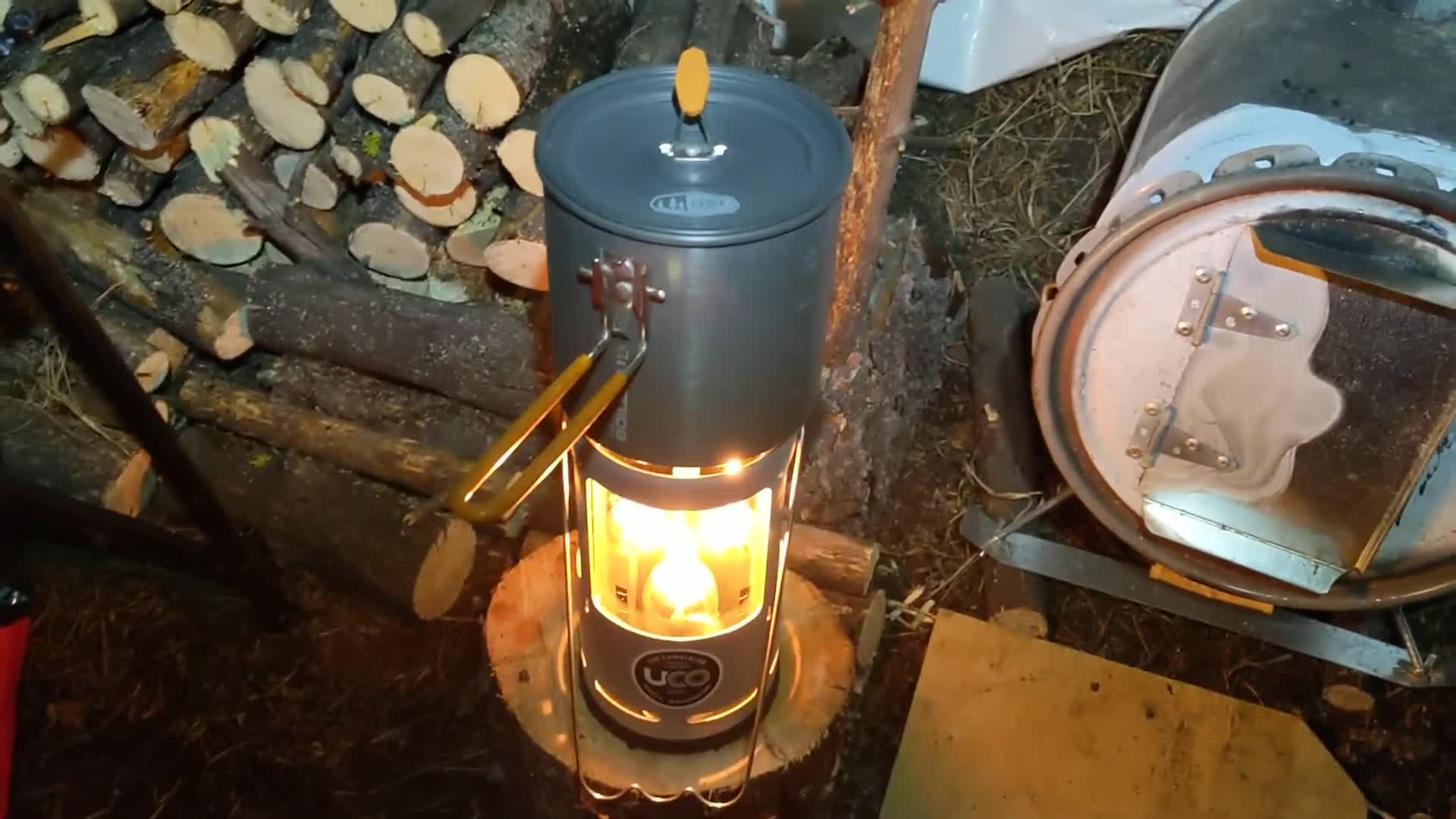 A pot of beans sits atop the UCO Candle Lantern.