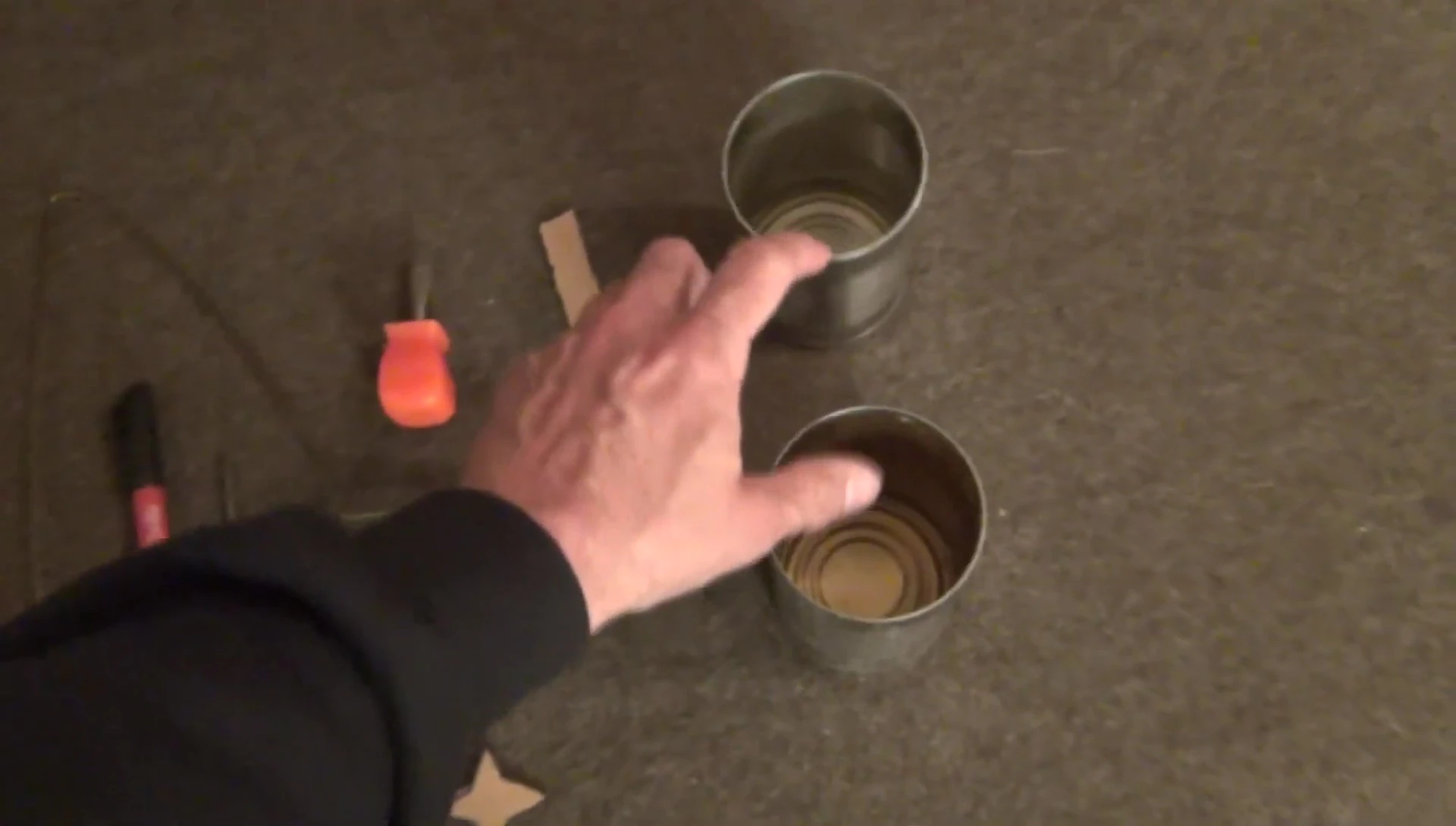 Two tin cans with labels removed, ready for the project.