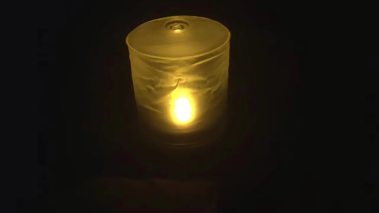The reviewer introducing the Luci candle.
