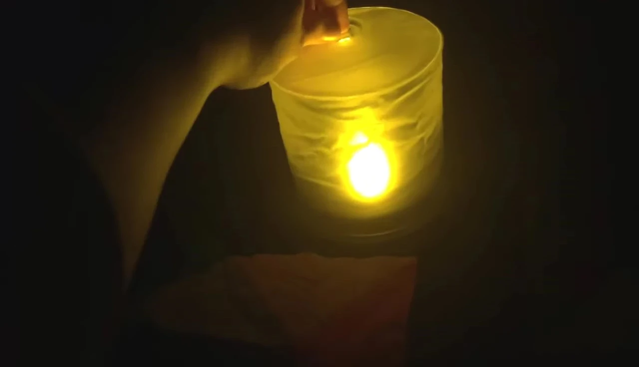 The Luci candle being deflated and compressed.