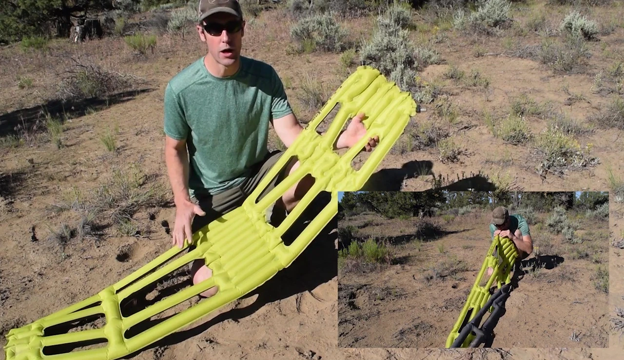 Person inflating the sleeping pad using their mouth.
