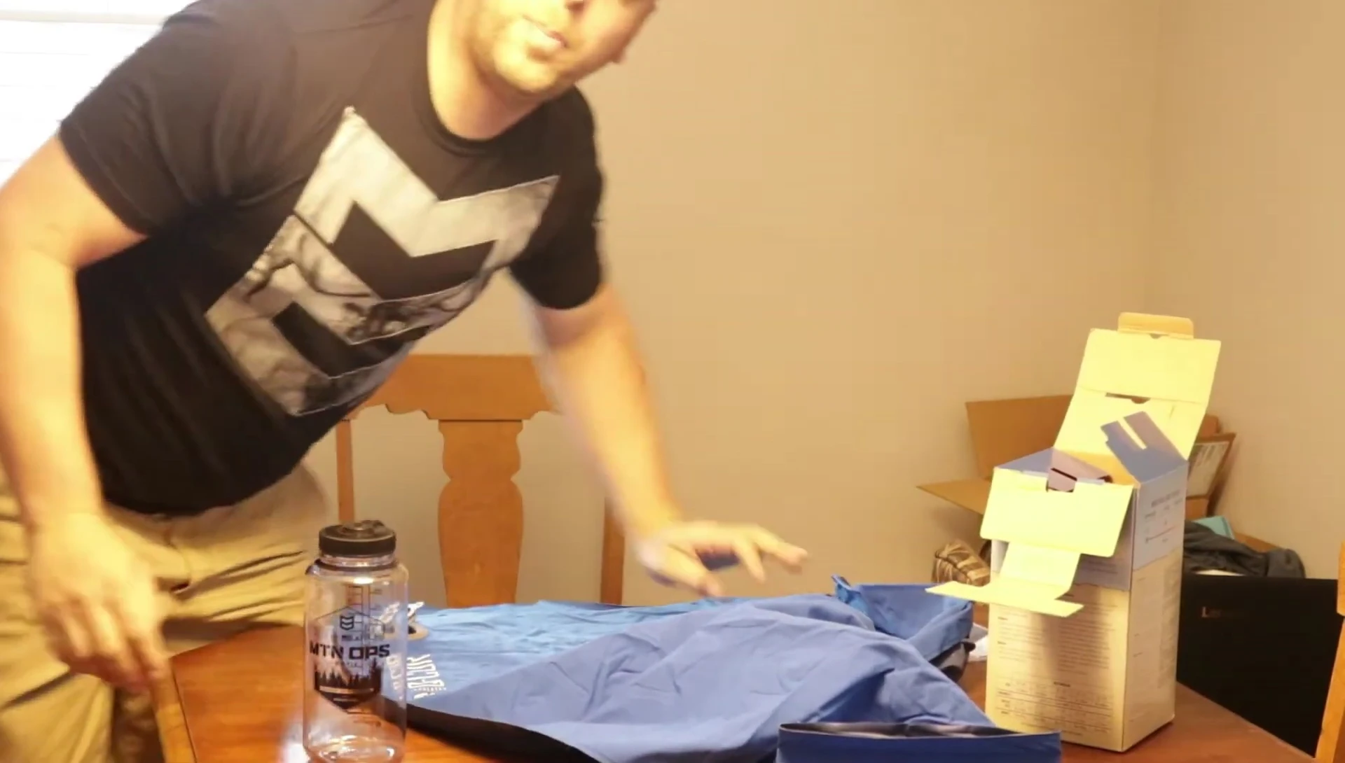 The reviewer inflating the sleeping pad.