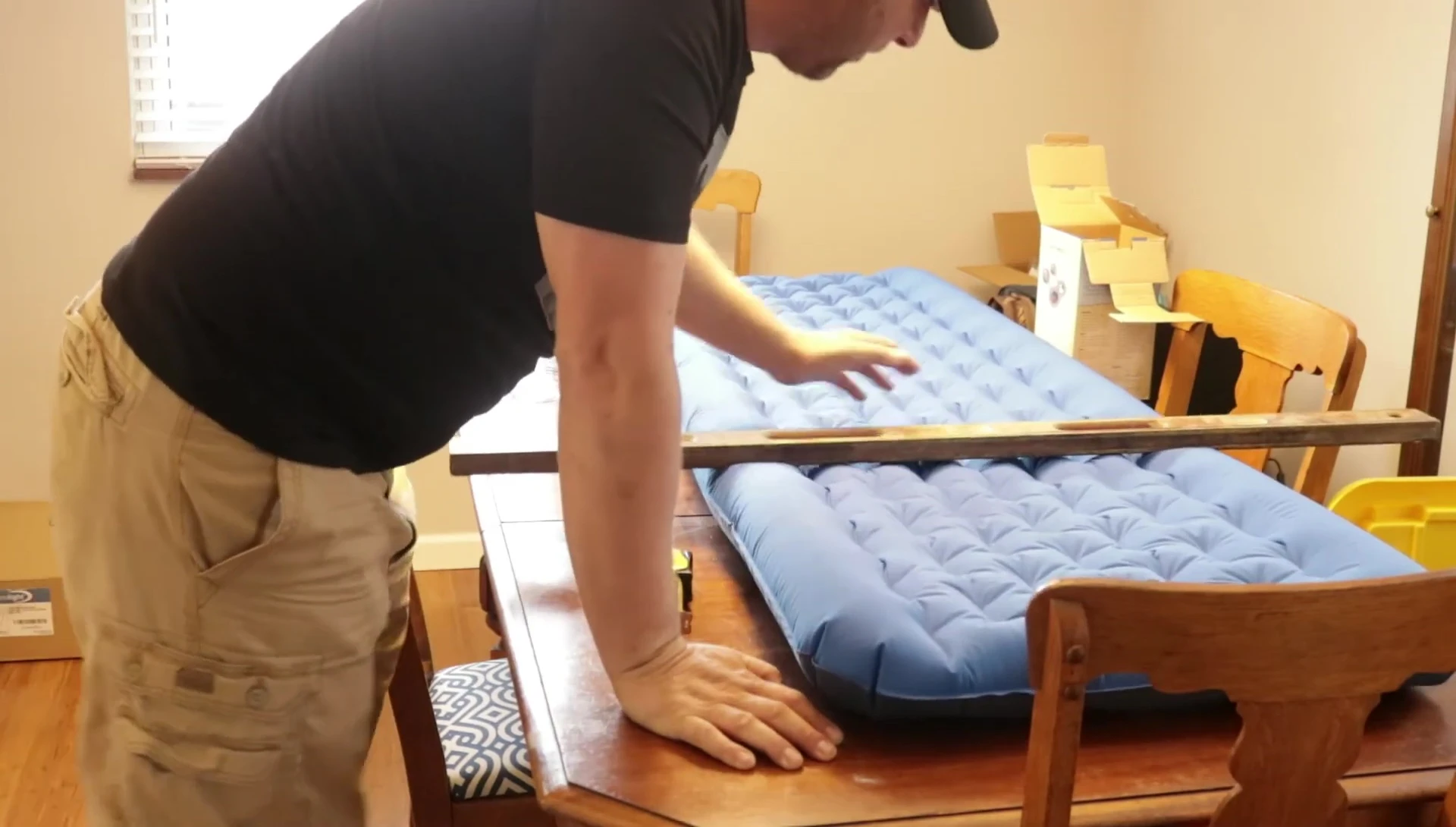 Measuring the length of the sleeping pad.