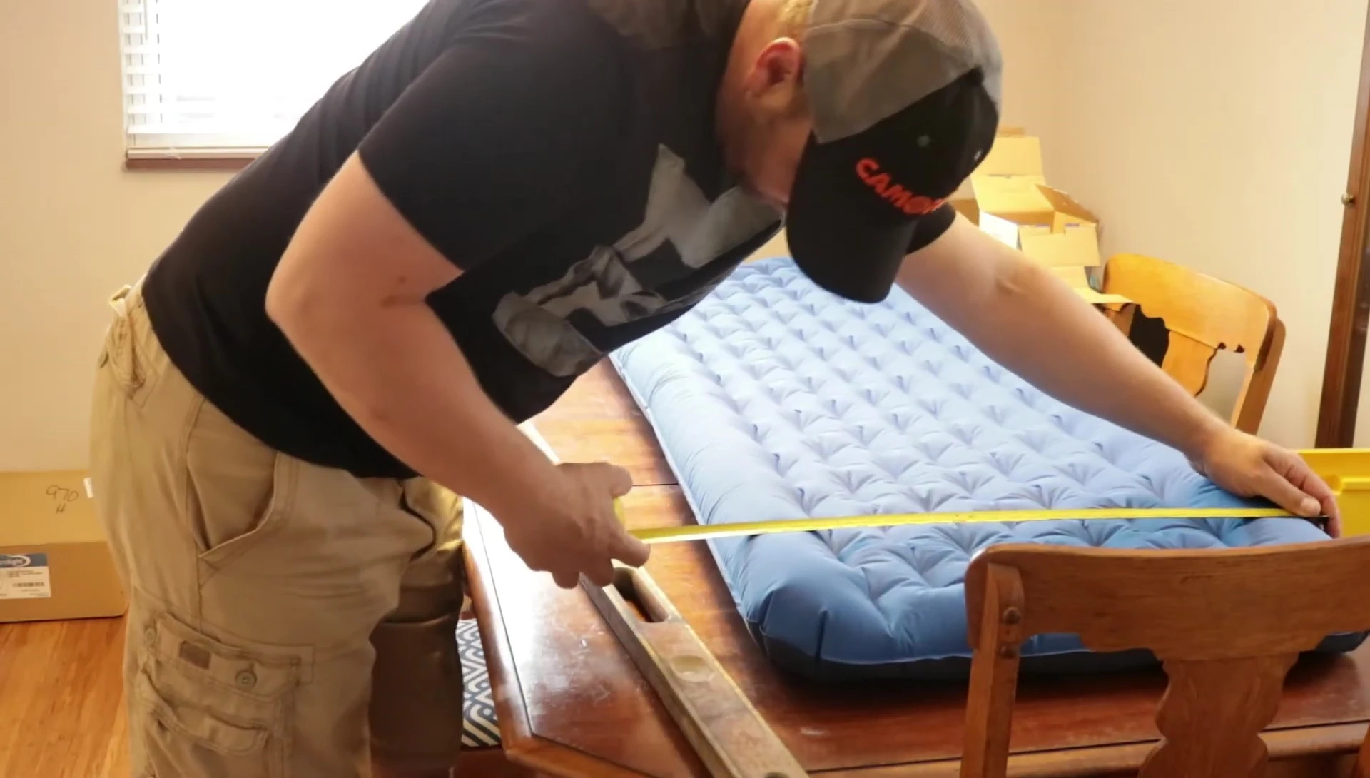 Measuring the width of the sleeping pad.