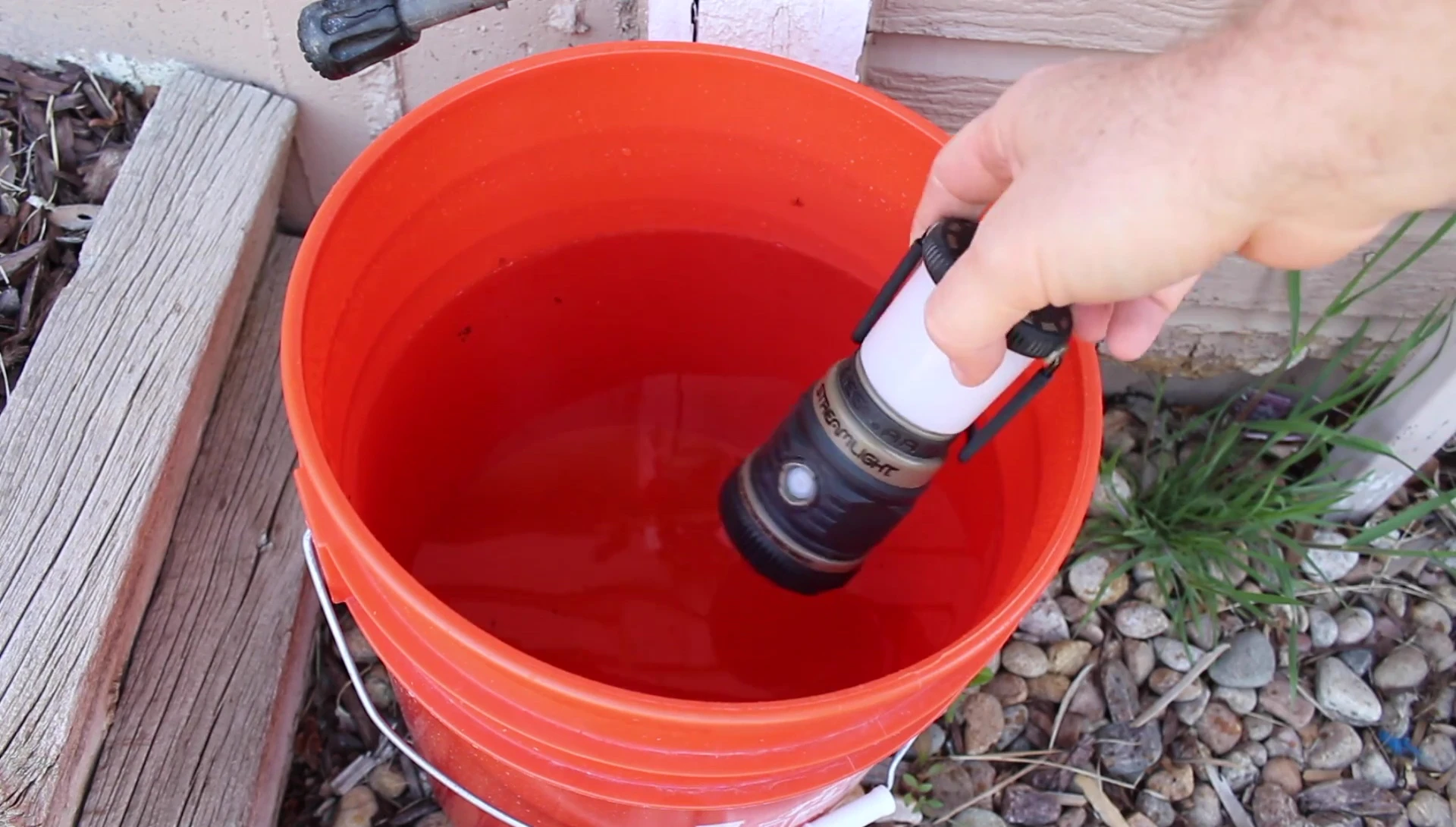 The lantern floating in water to demonstrate its buoyancy.