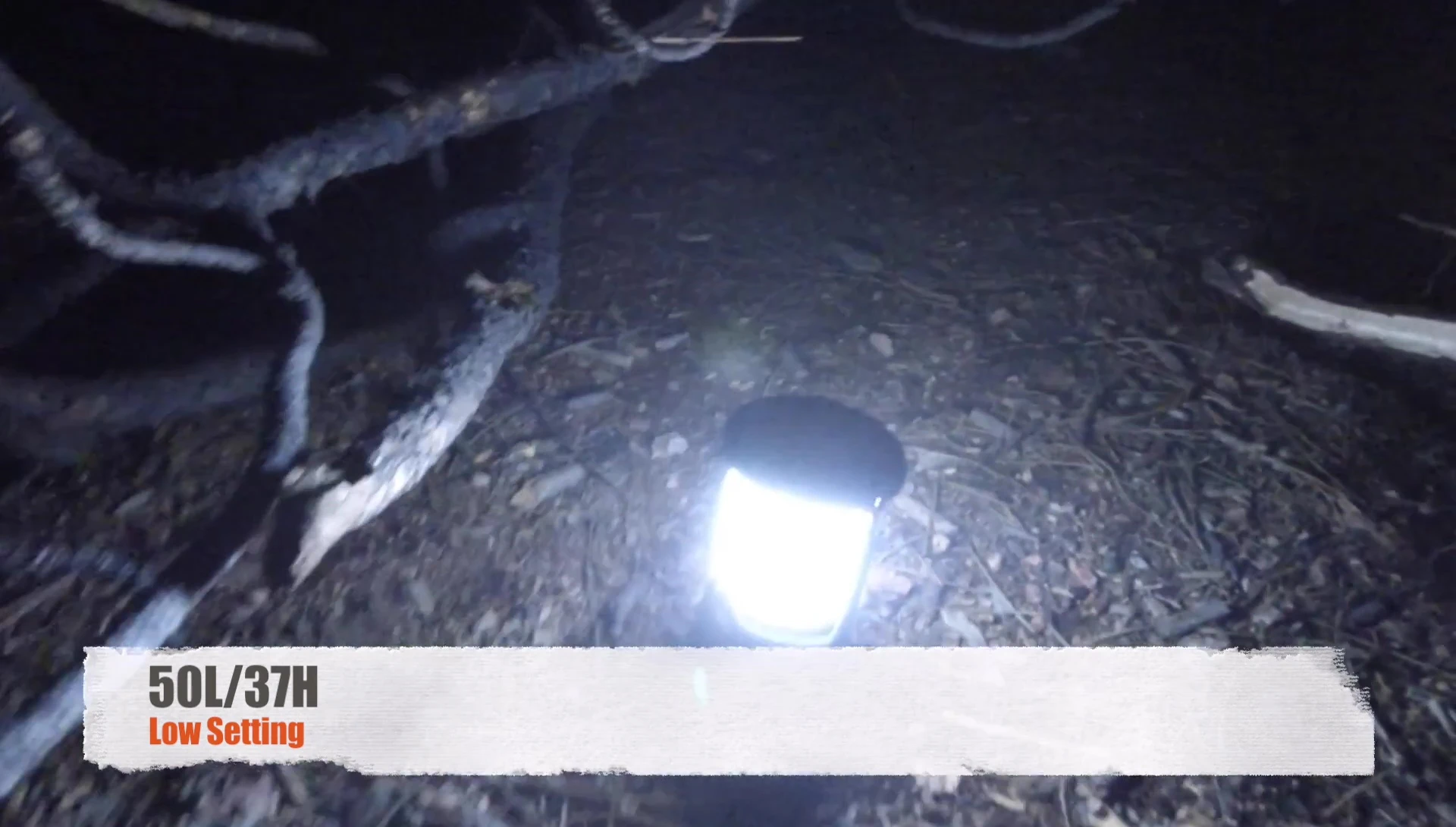 The lantern illuminating a picnic table.