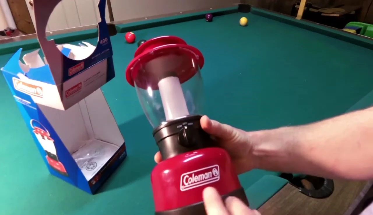 The lantern with its distinctive Coleman branding and metal handle