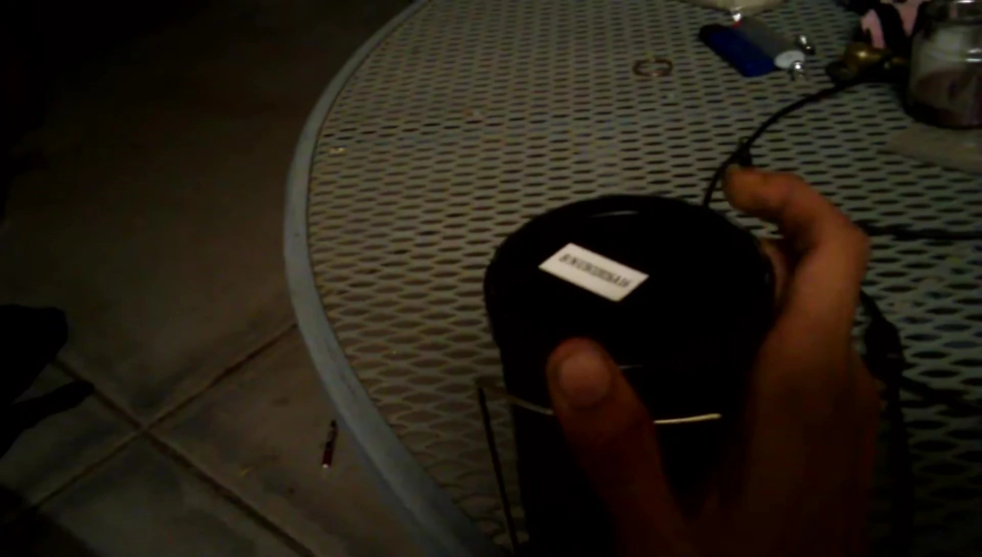 Accessing the battery compartment at the bottom