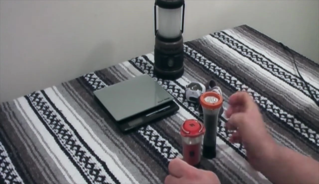 The speaker demonstrates the Black Diamond Orbit's hanging mechanism
