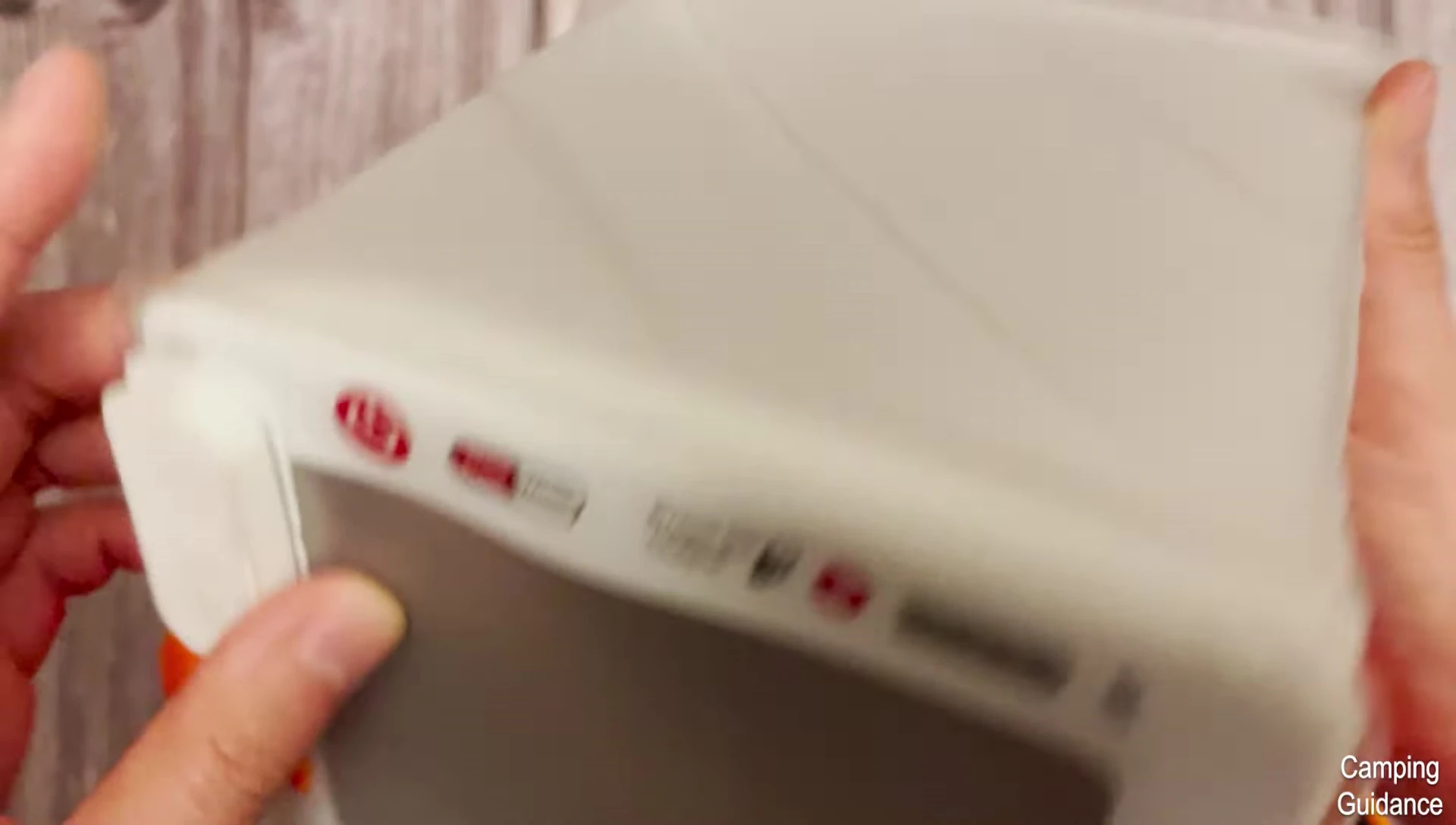 Using the red and white mode selection buttons.