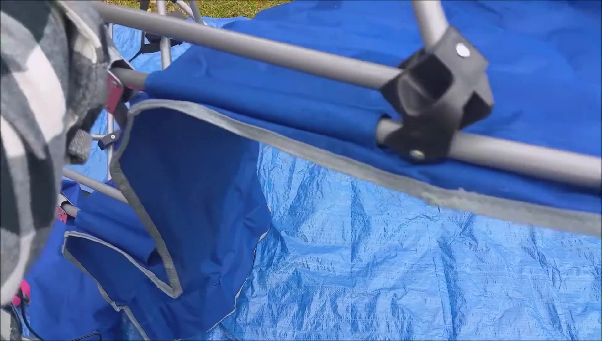 Demonstrating the easy setup of the cot.