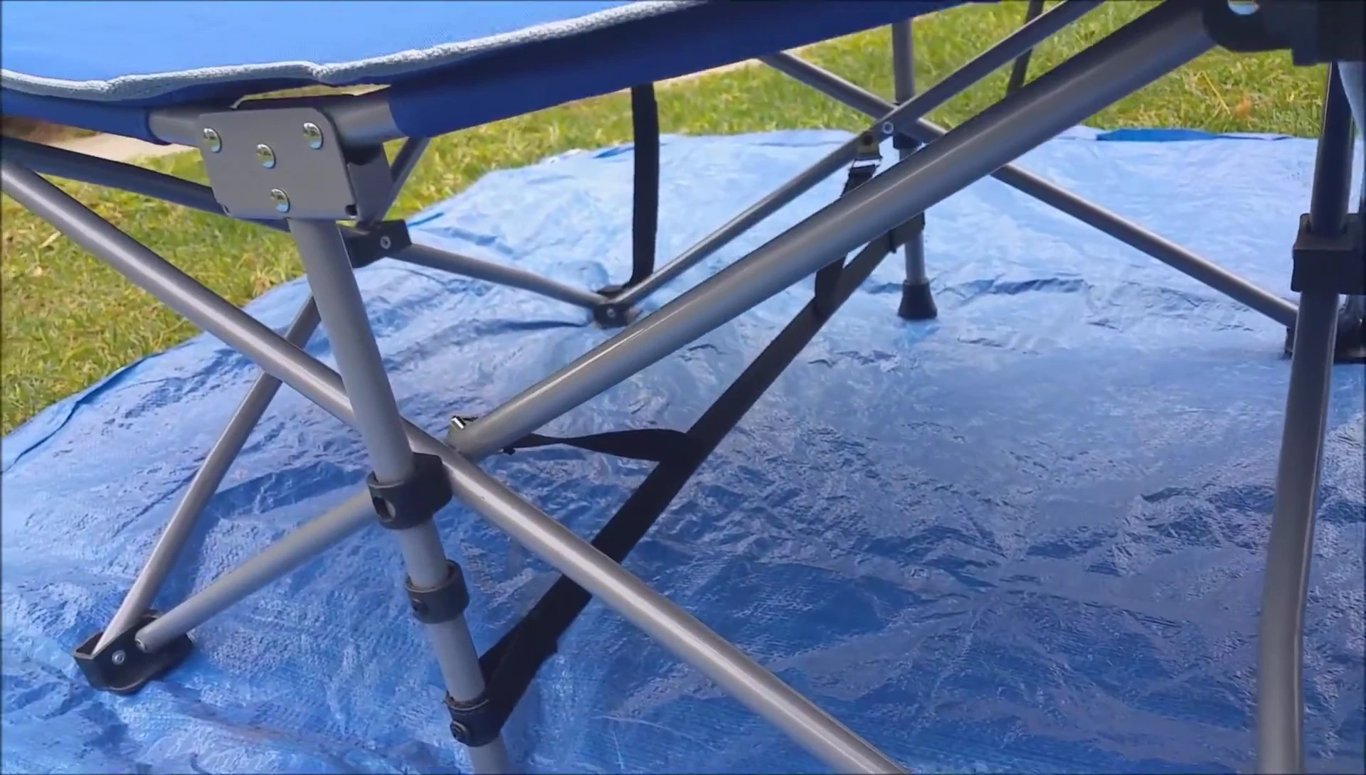 View of the cot's underside showing the lack of a central support beam.