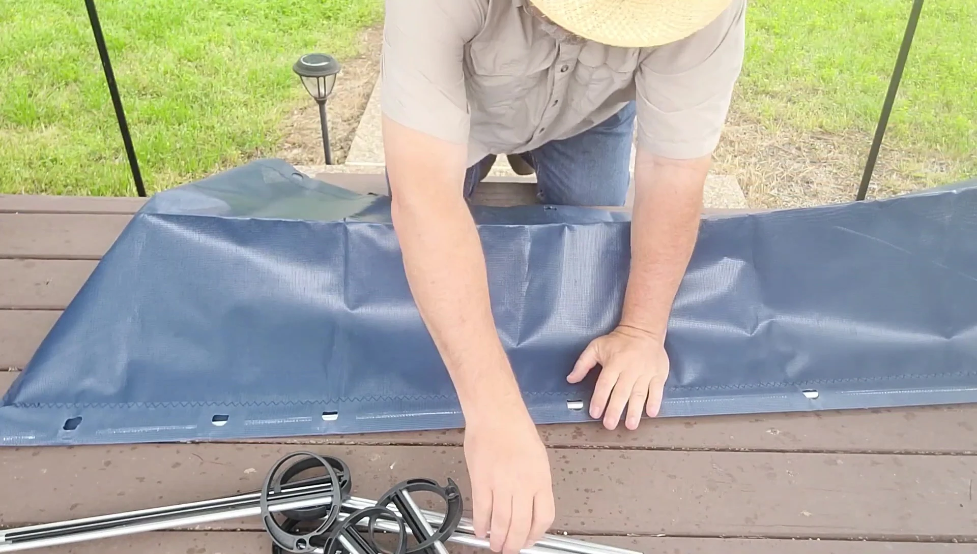 The narrator showing how he inserts one of the poles