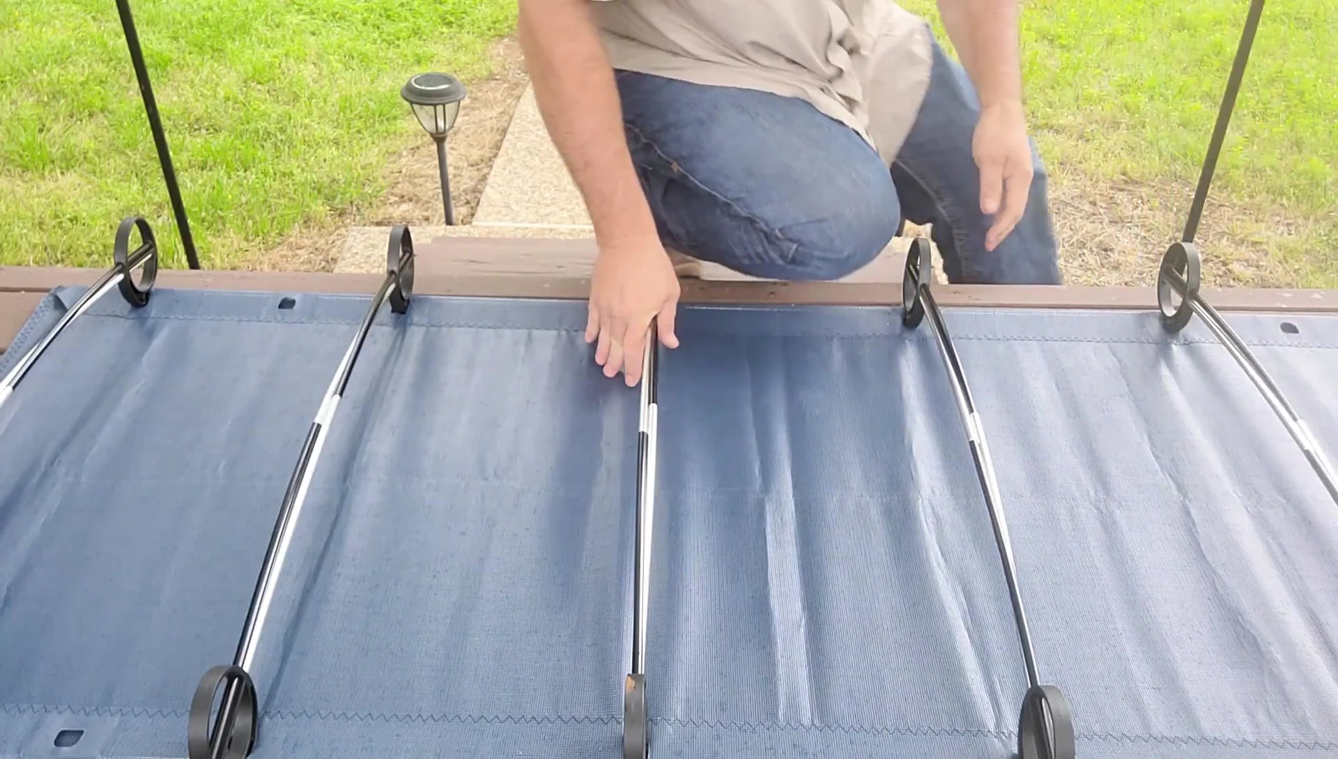 The narrator showcasing the assembled cot