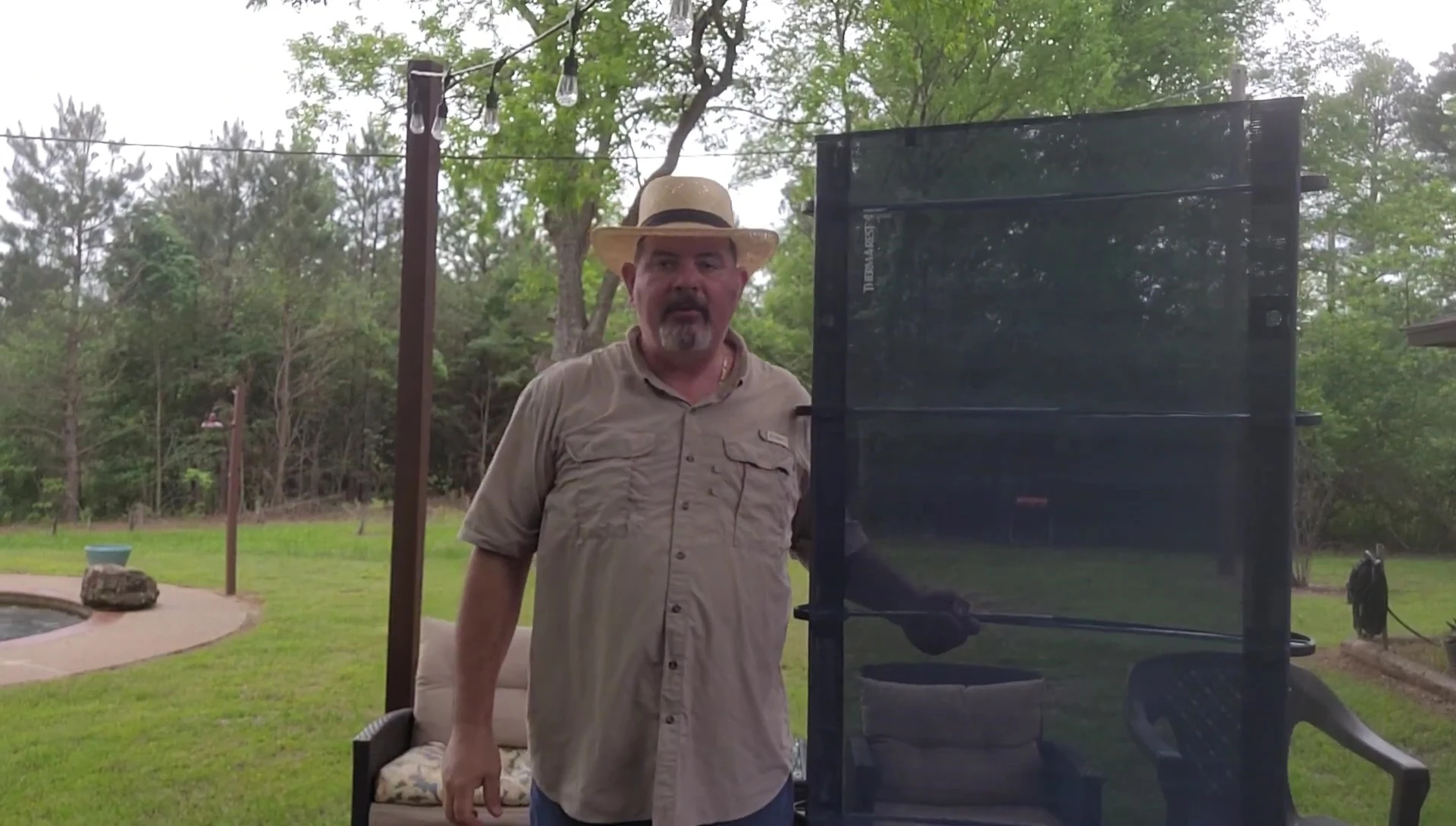The narrator standing next to the cot, demonstrating its height