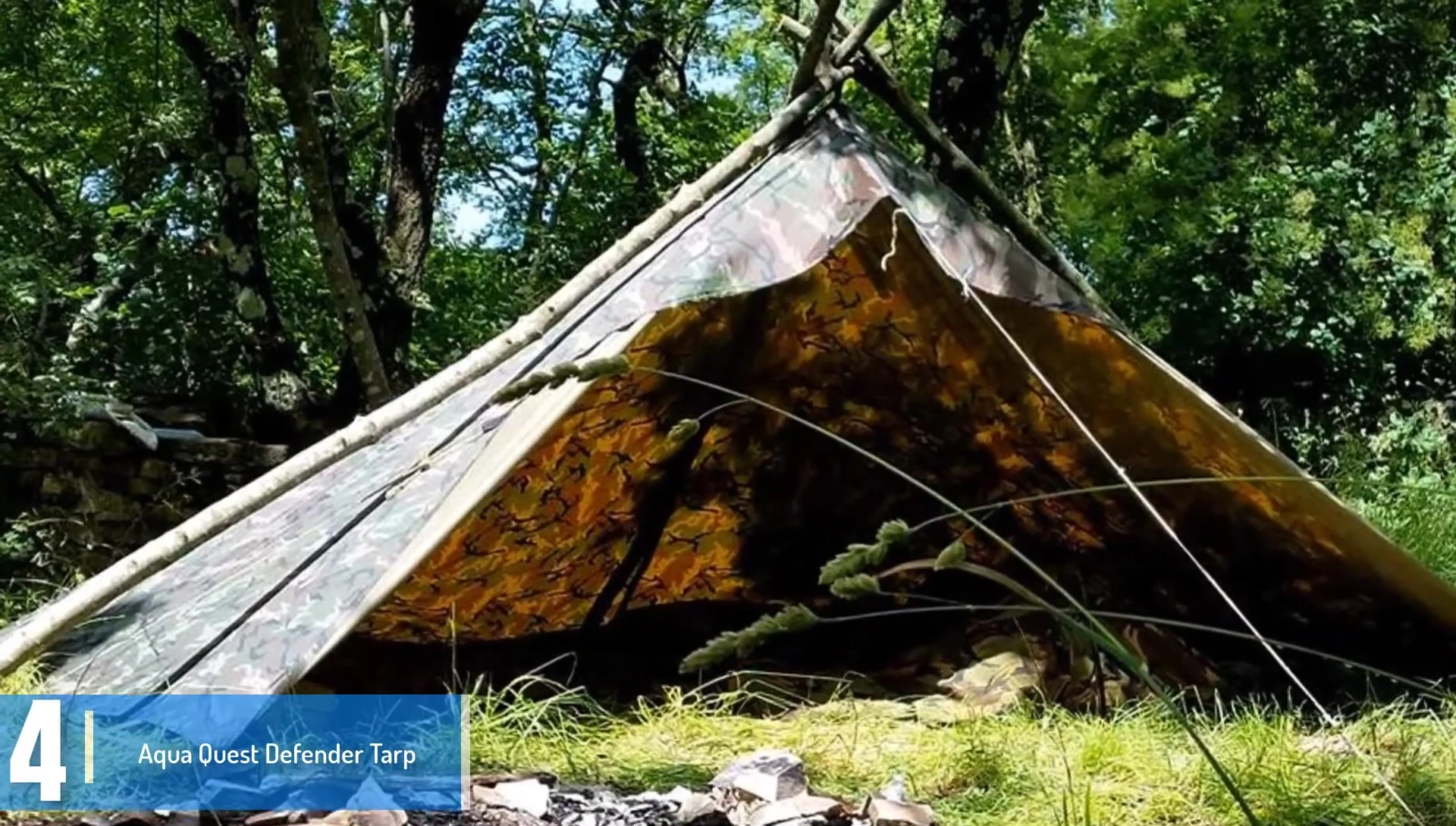 Aqua Quest Defender Tarp shown, emphasizing its rugged construction.