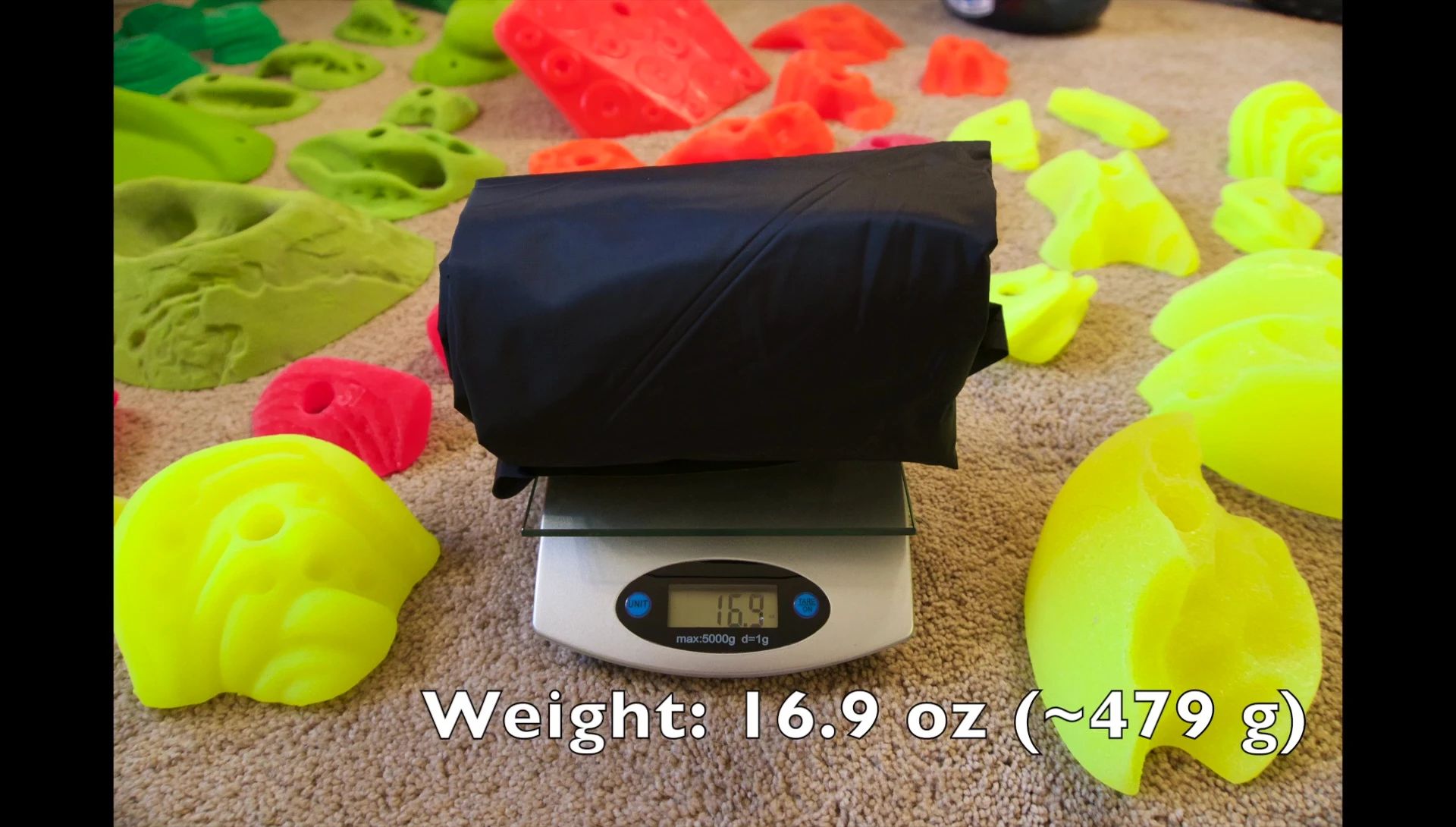 Close-up of the Klymit Static V Ultralight Insulated sleeping pad on a scale.