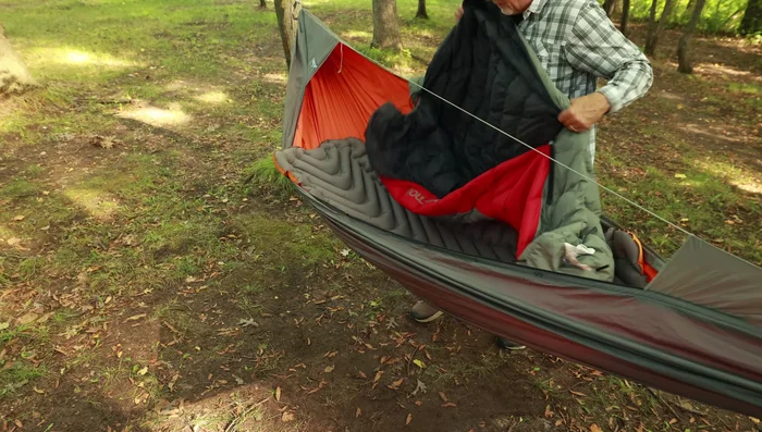 Slide your feet into the foot box and drape the rest of the sleeping bag over you.