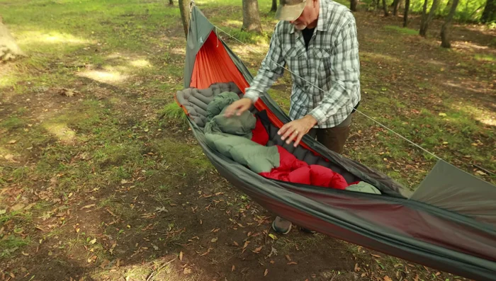 Slide your feet into the foot box and drape the rest of the sleeping bag over you.