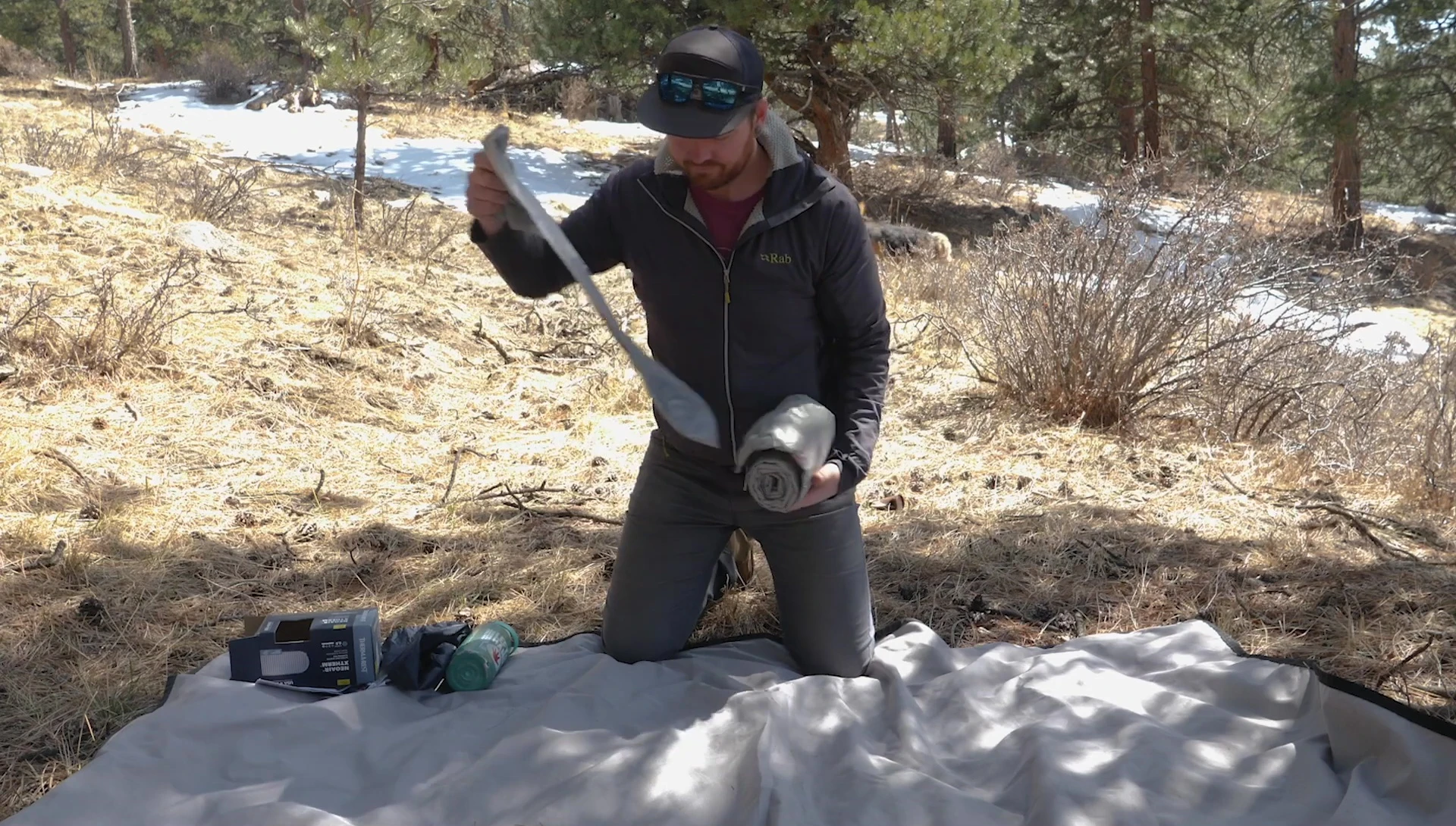 Inflating the sleeping pad using the pump sack.