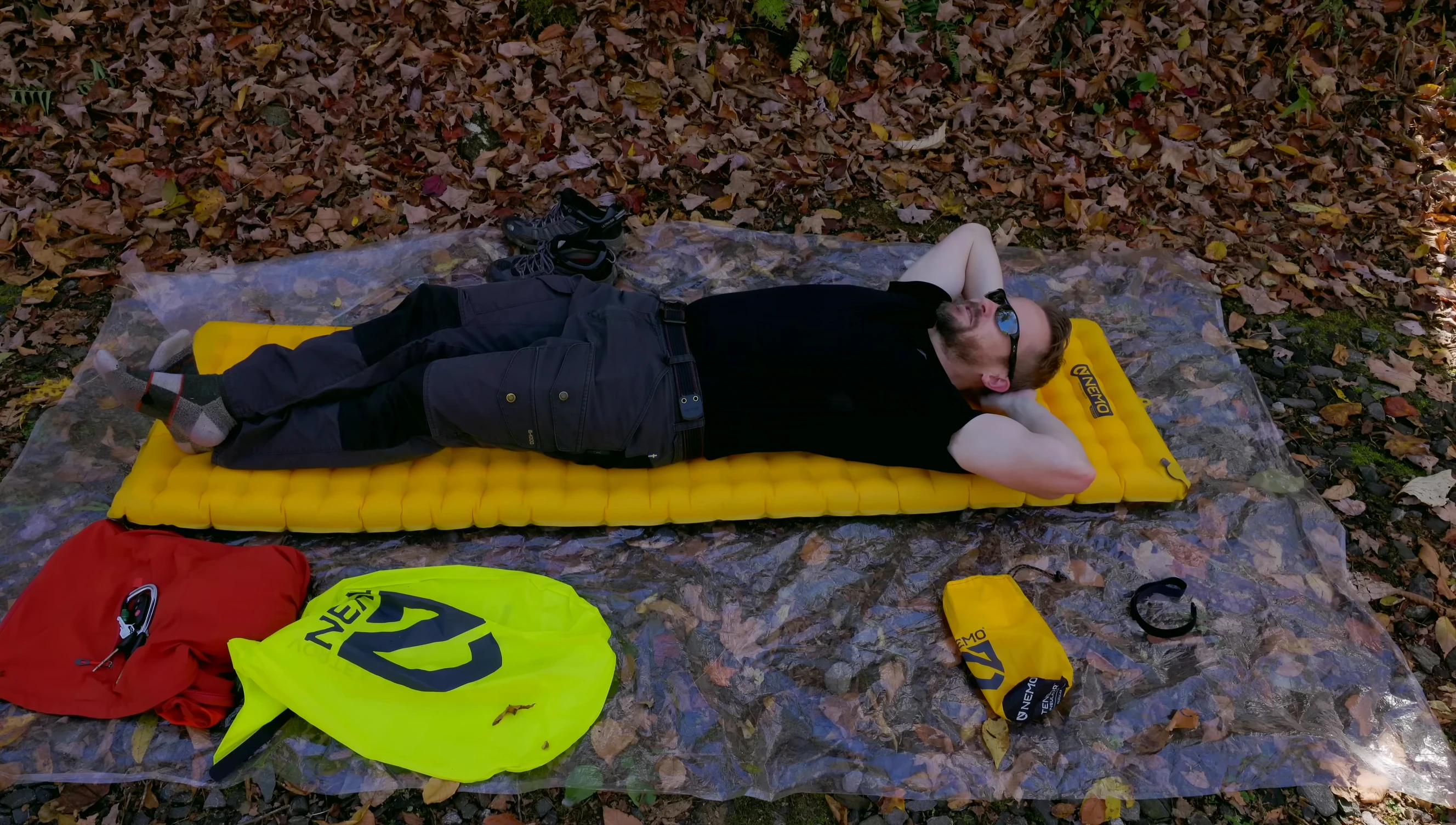 The reviewer demonstrating the comfort of the Nemo Tensor sleeping pad.