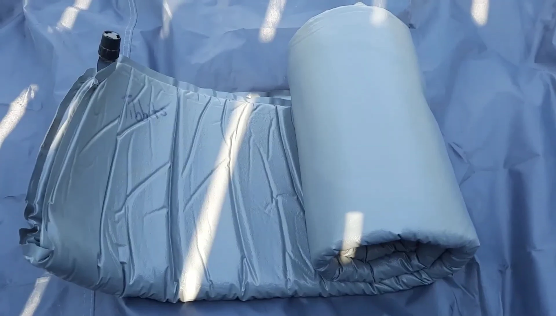 The Thermarest Scout sleeping pad still in its compressed state.
