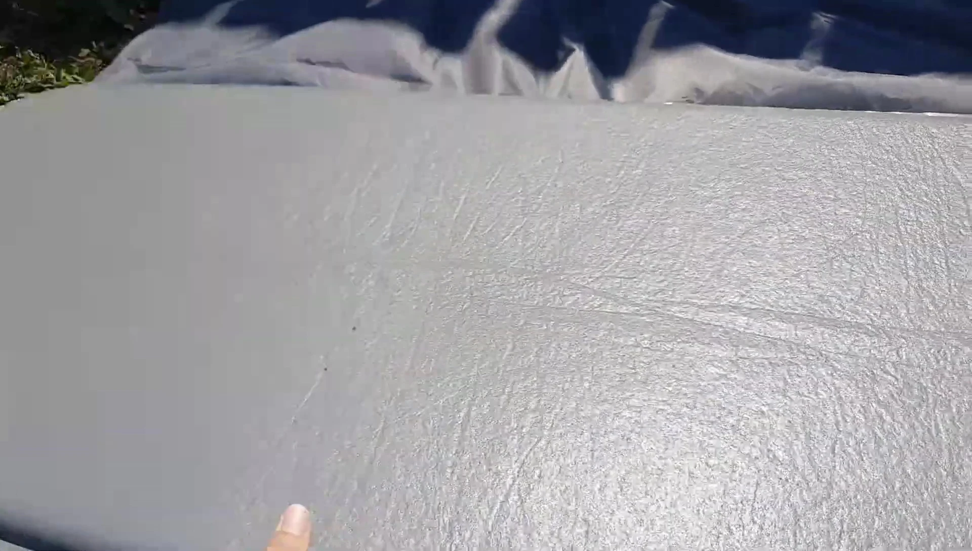 Close up highlighting the sleeping pad's thickness and durability.