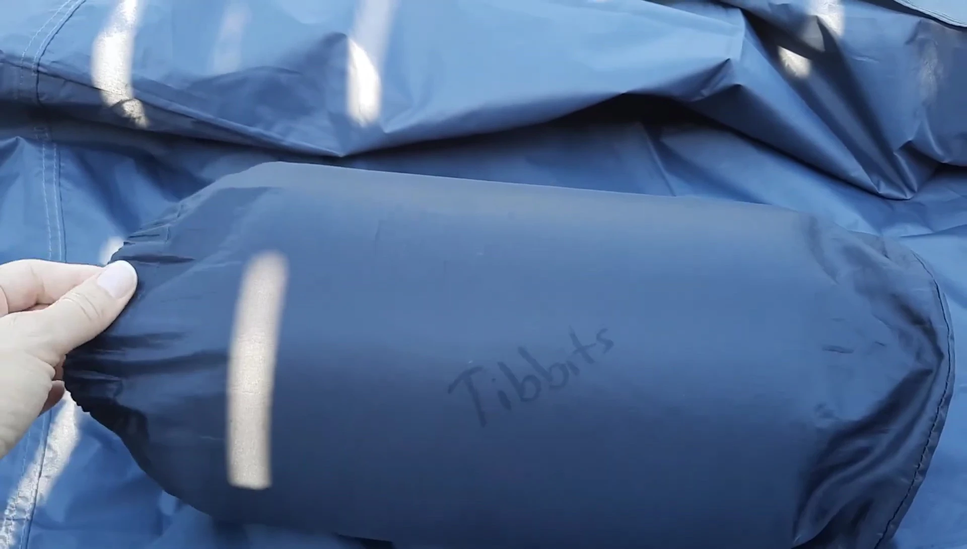 The reviewer showing the Thermarest Scout after years of use.