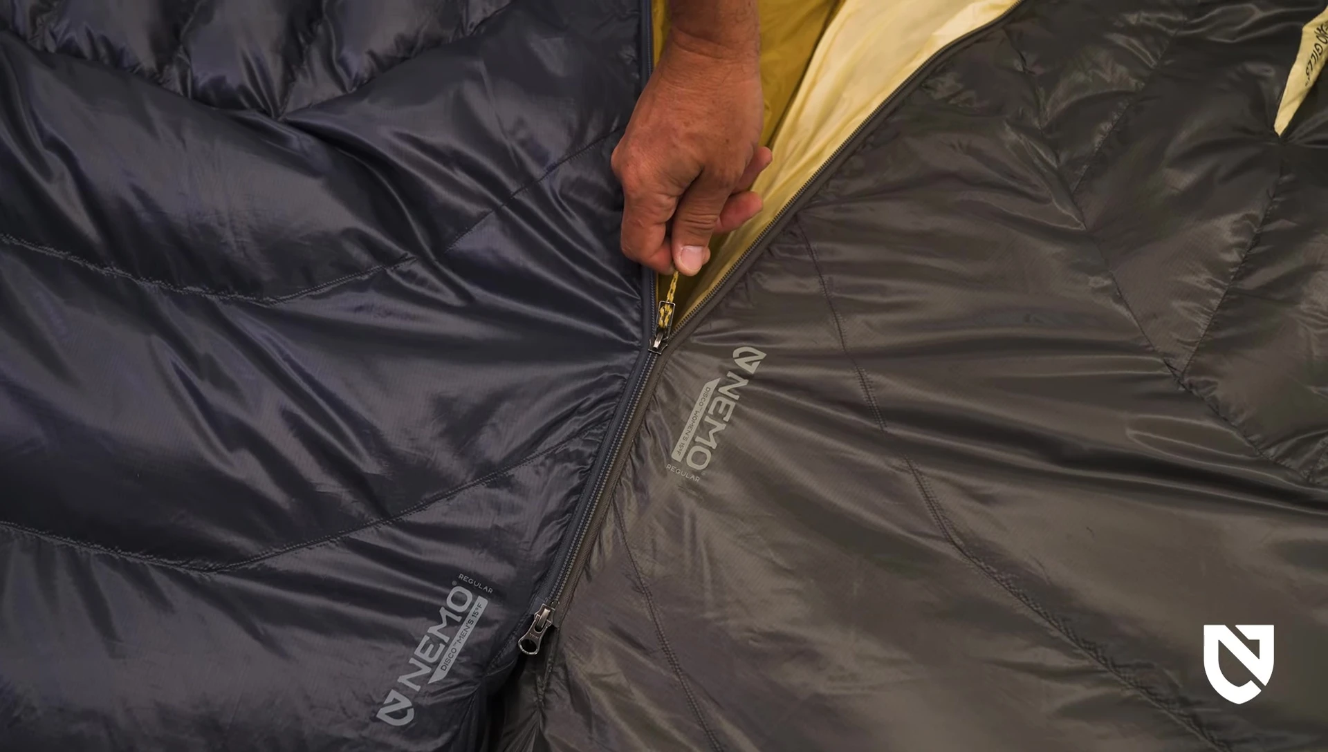 Demonstration of two sleeping bags being zipped together