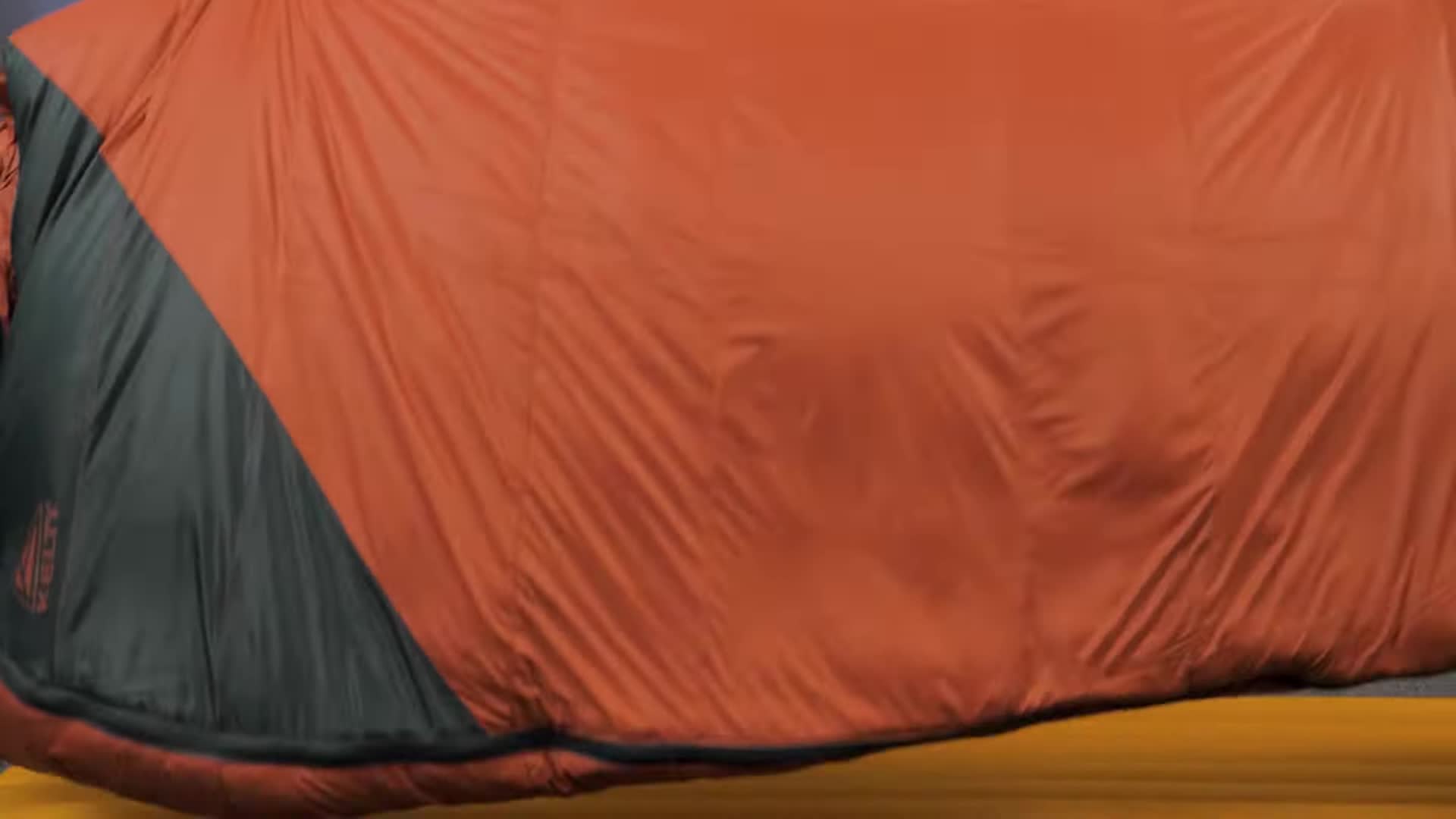 Close-up shot of the Kelty Cosmic Down sleeping bag showing the insulation