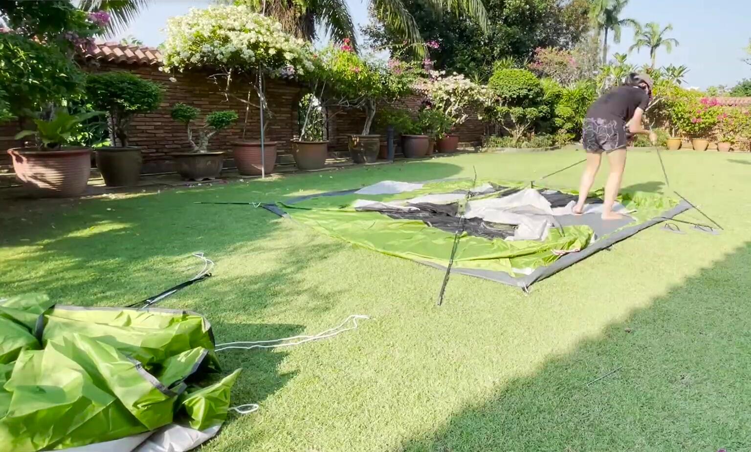 Illustrating the ease of setup with the Sundome tent's pole sleeves