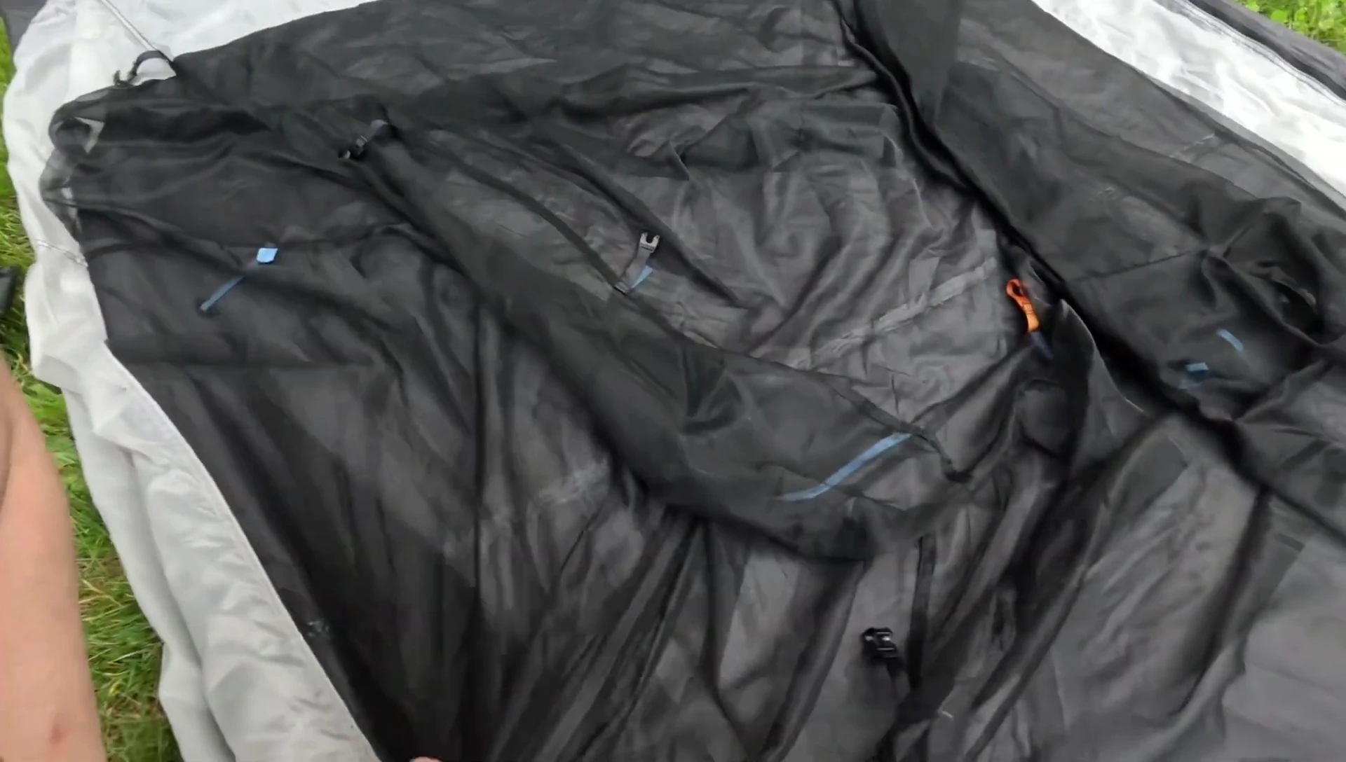 Securing tent with orange clips