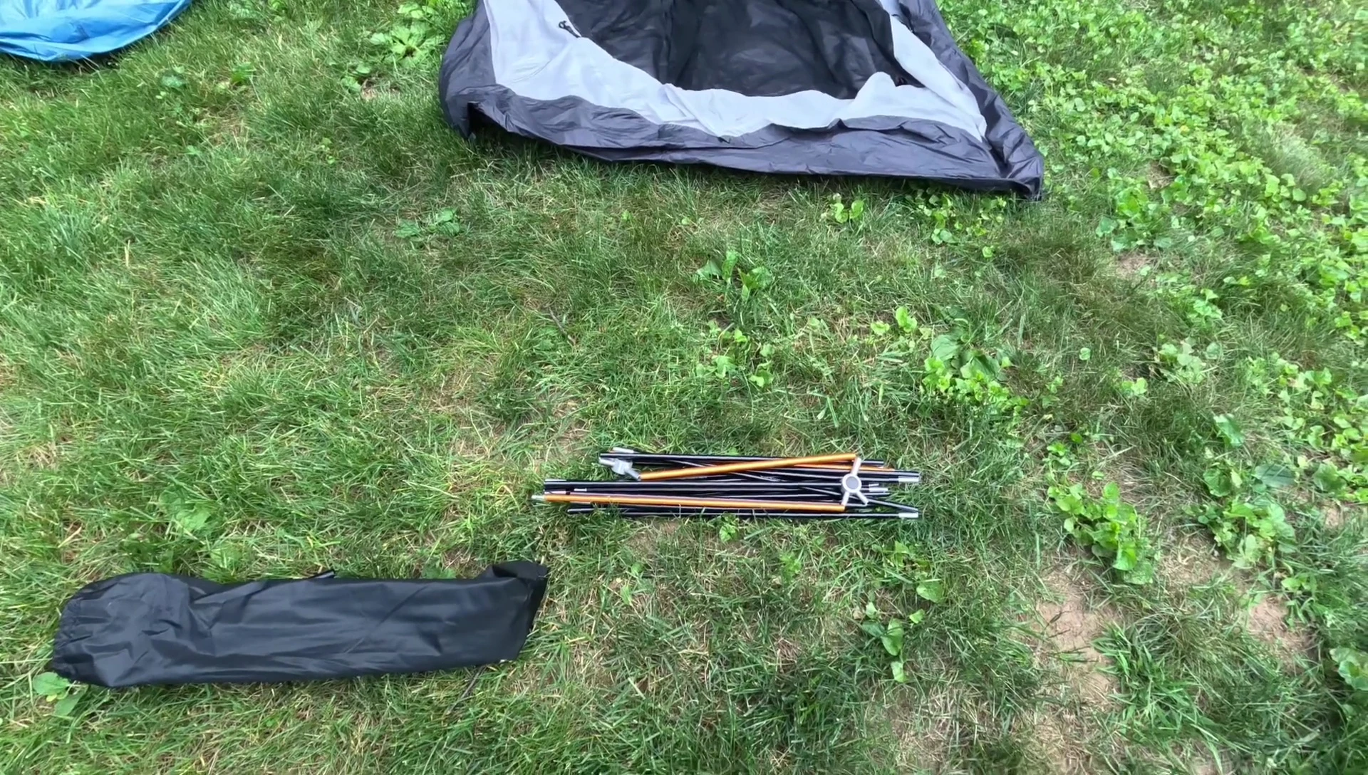 Person connecting tent poles