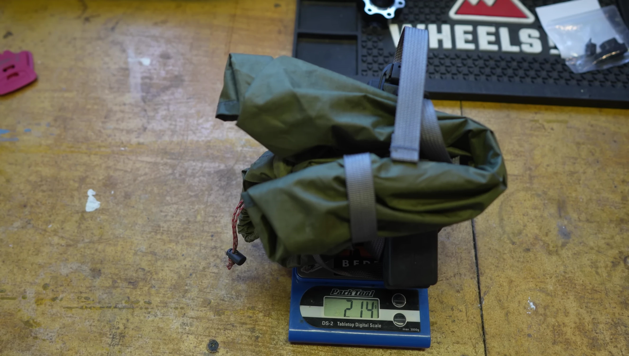 The weight of the one-person tent displayed on a scale.