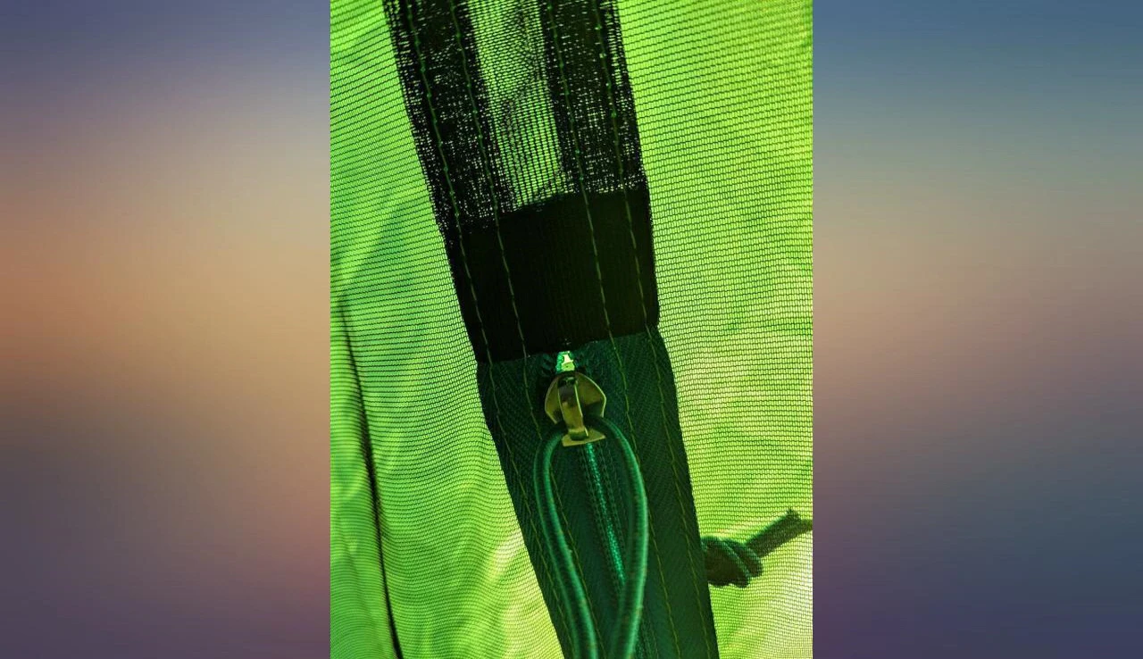 Image showing the reviewer setting up the tent in their backyard