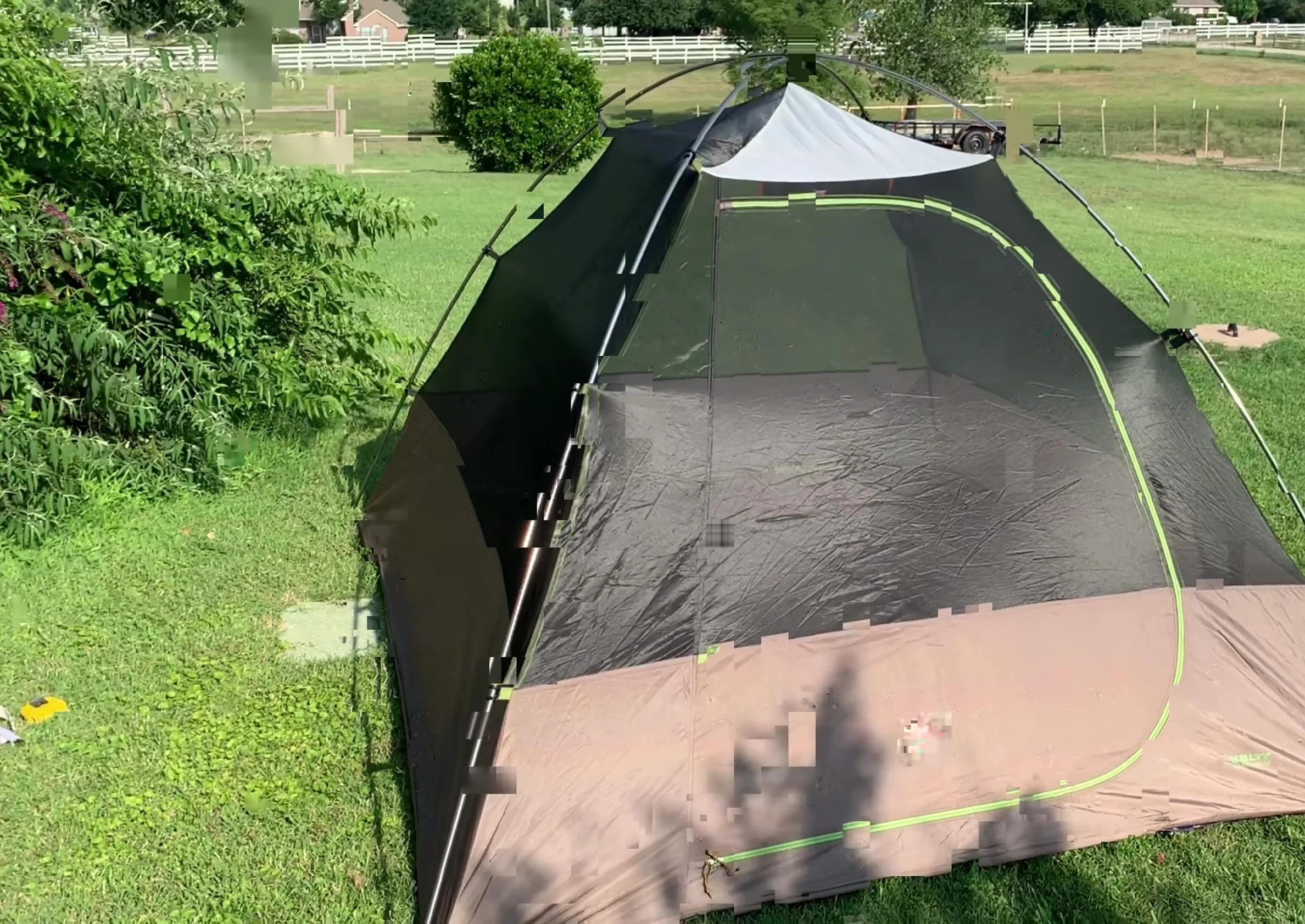 The tent partially set up showing the mesh panels.