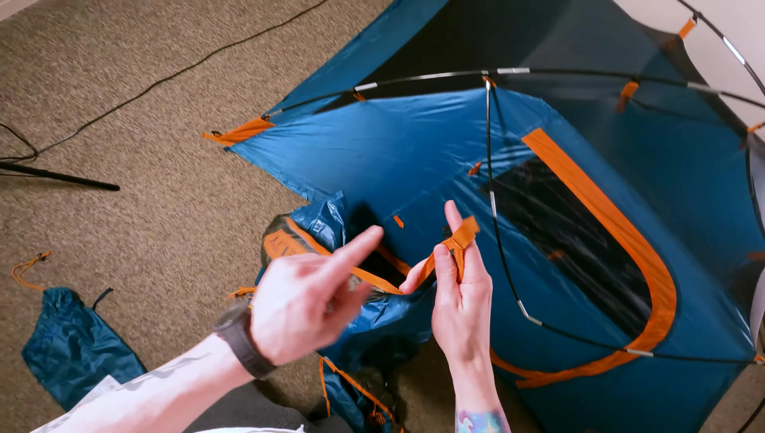 Attaching the rainfly.