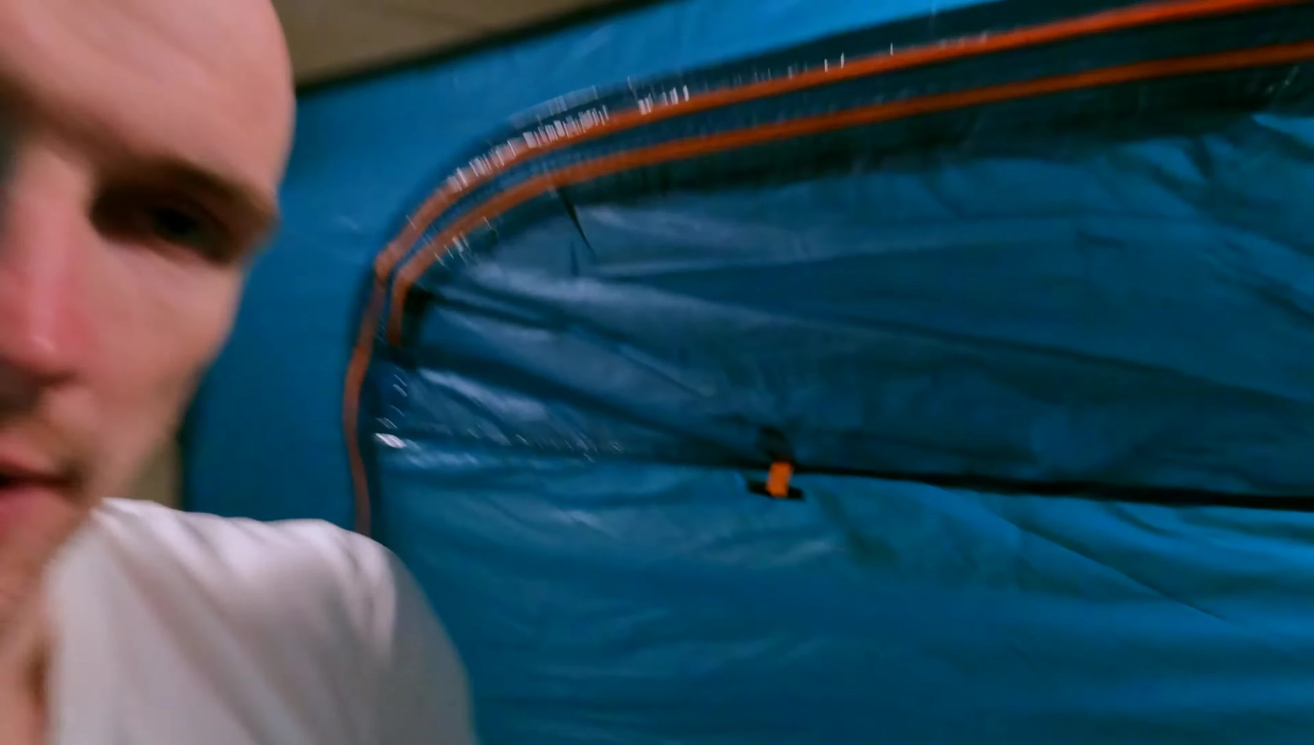 Reviewer laying down in the tent, showing the length limitation.